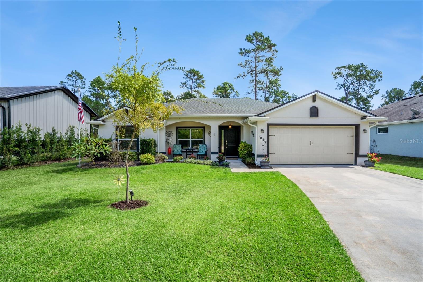 Better Than New! Updated home in a Peaceful Deland Setting. Escape to your own quiet, better-than-new 2020 home, perfectly situated in a rural Deland neighborhood just minutes from the vibrant historic downtown. This meticulously maintained 3-bedroom, 2-bathroom residence offers a rare combination of updated luxury, practical amenities, and a serene, natural setting. Step inside and be greeted by a bright and open floor plan with wood look laminate throughout, ideal for both relaxing and entertaining. The heart of the home is the open kitchen, which boasts a large island with gleaming granite countertops, stainless steel appliances, and a GAS range for the discerning chef. The spacious living area flows seamlessly to a screened lanai, where you can enjoy your morning coffee or unwind in the evenings overlooking the beautifully landscaped and fully fenced backyard. This home is not only beautiful but also equipped with an impressive array of features such as custom closets in Primary and Bedroom 2, dual sinks in primary bath, keyless entry lock, crown molding on kitchen cabinets. A brand-new HVAC unit (installed in 2025) with a transferrable warranty, a whole-house water filtration and softener system, with extra filtration at the faucets, provides pure and refreshing water, gutters and irrigation system using well water. For added security and self-sufficiency, the property includes a GENERATOR, security cameras, and propane gas. With no HOA, bring your boat, RV, camper or work trucks. With a spacious 2-car garage and the two 50-amp RV hook-ups, there is ample space for all your vehicles and toys. The property's location provides the perfect balance of a peaceful retreat and easy access to the charming shops, restaurants, and cultural attractions of downtown Deland. With its historic murals, art walks, and lively atmosphere, Deland offers a unique Old-Florida charm that you will love to call home. Don't miss this exceptional opportunity to own a truly move-in-ready home with all the modern upgrades you desire. Schedule your private showing today!