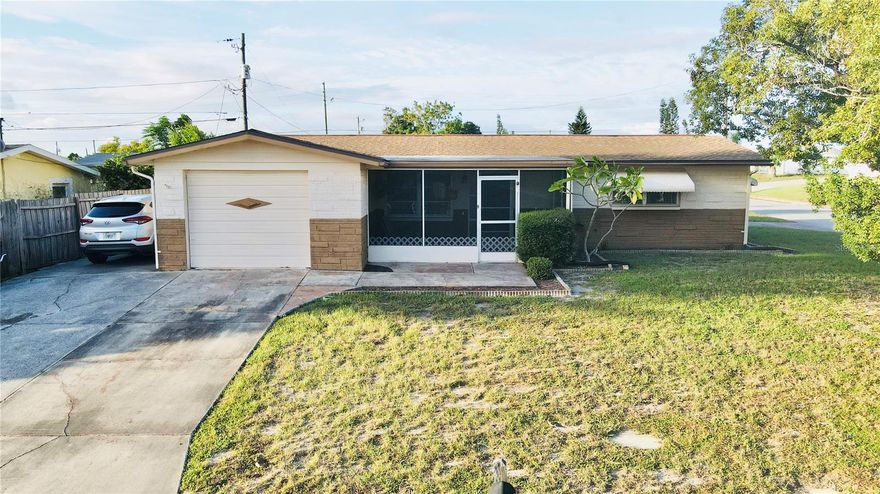 Welcome to this well maintained, Corner lot home in Crest Ridge Gardens! Walking in you will be greeted in to large welcoming living room/dining room combo. Both large bedrooms feature built in closets. Ceramic tile flooring can be found in both the kitchen and the bathroom, with carpet throughout the rest of the home. The back of the house opens up to a possible dining room area or breakfast nook. There is also an indoor jacuzzi room that could either be kept or used for a bonus 3rd bedroom! This home is a corner lot with plenty of front yard and even a bonus driveway on the side of the house, perfect for anyone wanting to bring their boat! Roof - 2019, A/C - 2000, Electrical Panel - 2006, Septic tank & Drain Field - 2016. This home is located in an amazing neighborhood, close to all things that make Florida living great! Clearwater Beach is only about 30 mins away. Local boat ramps and fishing docks are only about 10 mins away. The Tarpon Sponge Docks is only about 10 mins away. No HOA, NO CDD AND no flood insurance required!