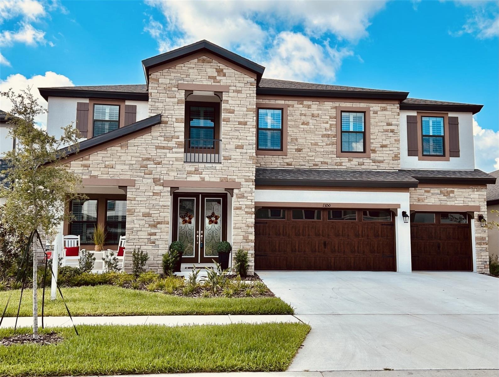 NEW TO MARKET! This gorgeous 5 bedroom + den+huge bonus room, 4 bathroom nearly new home has 3606 square feet of luxurious living space! This open floor plan is huge and features Kinsdale Maple Slate cabinets, Frostwhite MSI Quartz counter-tops and Prominence Plus Executive Oak LVP flooring. Enjoy both indoor and outdoor living with an oversized lanai, accessible through the combination great room, expansive kitchen and breakfast area. The first floor also features a den, secluded guest suite and bath. Upstairs, are the large secondary bedrooms with walk-in closets, large bonus room and laundry room. The second-floor owner’s retreat features an oversized walk-in closet and spacious bath. Hawkstone is a master-planned community. Residents enjoy resort-style amenities while staying close to top-rated Lithia schools, nature preserves, family-friendly activities, US-301, and I-75. Enjoy the pet-friendly hiking trails at the 969-acre Triple Creek Nature Preserve, less than 2 miles south or the bicycle motocross at Triple Creek BMX, 1 mile south of Hawkstone.