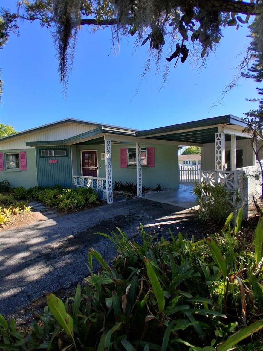 Custom designed and designed and built in 1963, this concrete block home has stood the test of time and durability.  The beach on Siesta Key is only 15 minutes away..  This is the lowest priced home listed in Shadow Lakes during the last two years.  Shadow lakes is a neighborhood of upscale homes on oversize lots in the north end of Gulf Gate. Most of the homes in the neighborhood, including this one, are on the series of ponds/preserves separating backyards of the  homes.  Adding to peace of mind for the new owner is a new roof that was completed March 2026.   The kitchen was recently remodeled to a high standard.  The separate laundry room off the carport includes a half bath.  The well-built storage shed measures approximately 10ft x 10ft.  Among the pictures you can view the large fenced patio area that encompasses the shed as well as an outdoor shower area concealed between the laundry room and shed.