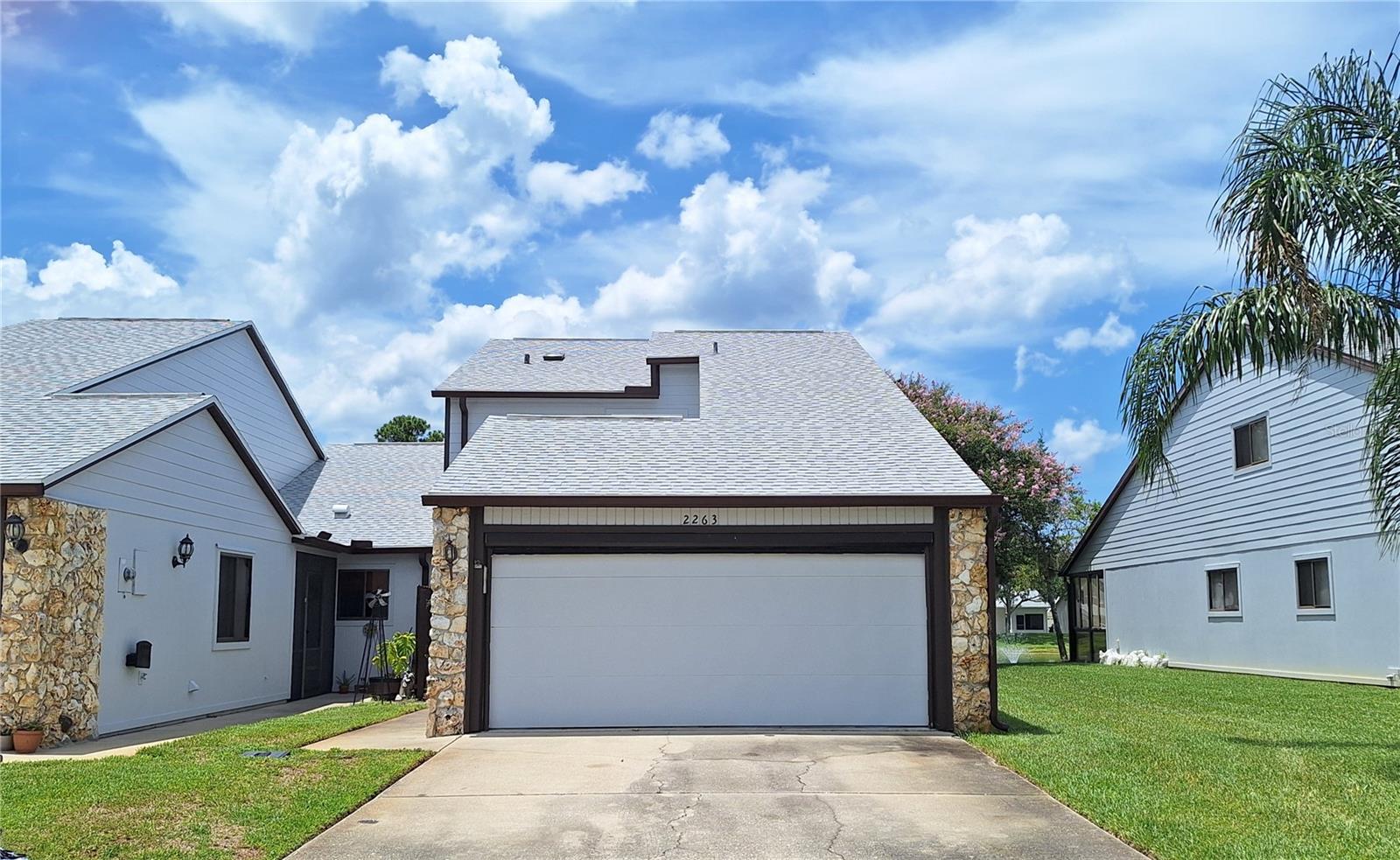 Welcome to Hidden Pines! A beautifully maintained community located in New Smyrna Beach, just minutes from I95, shopping, dining and the BEACH! Besides boasting a beautiful peaceful pond view from most rooms, this light and bright end unit Townhome features 2 bedrooms, 2.5 baths, and a loft. The downstairs main living area has vaulted ceiling with skylights, providing plenty of added natural light. LVP flooring in living areas, primary BR and loft. Super Convenient Ground floor Primary bedroom with ensuite bathroom, custom walk-in closet and spacious bath, and also an guest 1/2 bath downstairs. Kitchen features stainless appliances and plenty of cabinets. Head up the stairs and you will find the 2nd BR, 2nd full Bath, plus the loft, which can easily be used as another living area, bedroom or office/play room! Large Walk-in storage closet in loft as well as double closets in 2nd BR. Downstairs off the living room, the sliders open up to a nice size enclosed porch with pond view! Step outside onto the patio, which can be perfect for grilling or basking in the sun! This home is just steps away from the sparkling community pool and clubhouse (which has a full kitchen, restroom and lots of fun community events)! Also tennis courts & shuffleboard just around the corner. Association fee includes: exterior building maintenance, lawn care and common area maintenance. Buyer to verify all information, deemed accurate but not guaranteed.