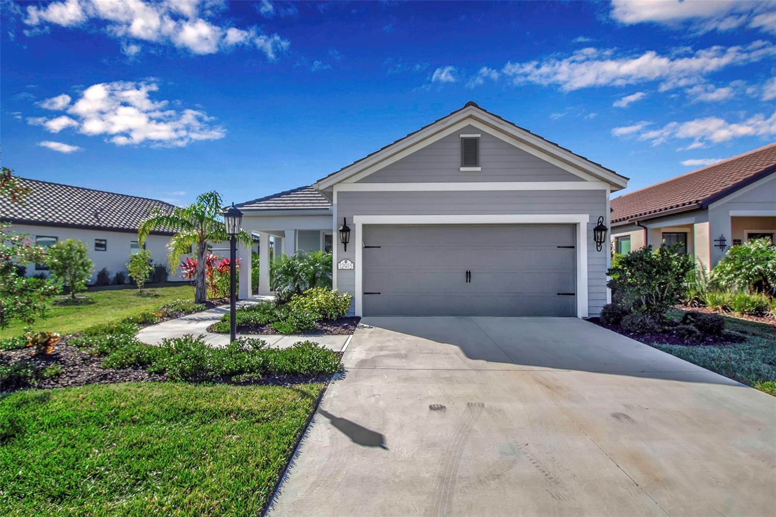 Welcome to this better-than-new ranch home, perfectly situated in the high-demand Indigo neighborhood. Hurricane impact windows for safety and peace of mind. An upgraded kitchen package with quartz countertops, a stylish backsplash, under-cabinet lighting, convenient pot/pan drawers, and stainless-steel appliances. A spacious primary suite featuring a double vanity, double walk-in closets, and a beautifully tiled walk-in shower. A functional laundry room with added cabinetry for extra storage. Offering serene rear pond views, and a roughed-in setup for an outdoor kitchen—perfect for entertaining. This sought-after community in Lakewood Ranch boasts resort-style amenities, including pickleball courts, a sparkling pool, a fitness center, a playground, and a vibrant community center complete with a kitchen and activities director. Lakewood Ranch offers an exceptional lifestyle, with access to top-rated schools, world-class beaches, shopping, dining, and entertainment options just moments away. Embrace an active lifestyle with the community's numerous parks, nature trails, sports facilities, restaurants, shopping and more!