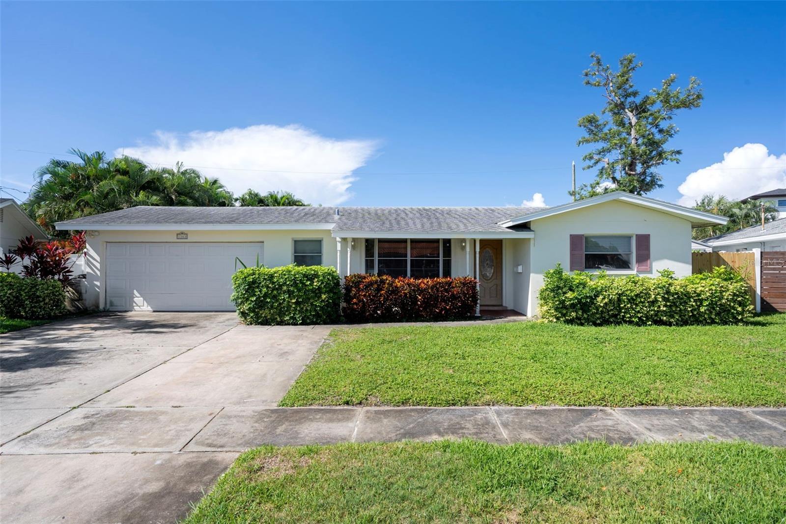 Beautifully updated 4BR/3BA single-story home with 2-car garage in the highly desirable Eden Isle community, adjacent to Snell Isle. Surrounded by multi-million dollar homes, this property offers incredible value in a prime location. Features include a renovated kitchen with granite countertops and newer stainless appliances, brand-new luxury vinyl flooring (2025), and dual AC systems (2025 & 2022). Enjoy an oversized, fully fenced backyard with new gates — perfect for entertaining. Located in a waterfront neighborhood just minutes from downtown St. Pete, beaches, shopping, dining, and easy access to TPA & PIE airports. Don’t miss this exceptional opportunity!