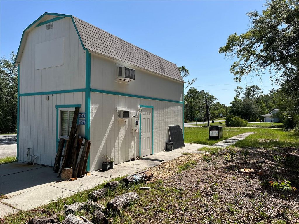 Photo of 18132 Commercial Way, Weeki Wachee, FL 34614 (MLS # W7877158)