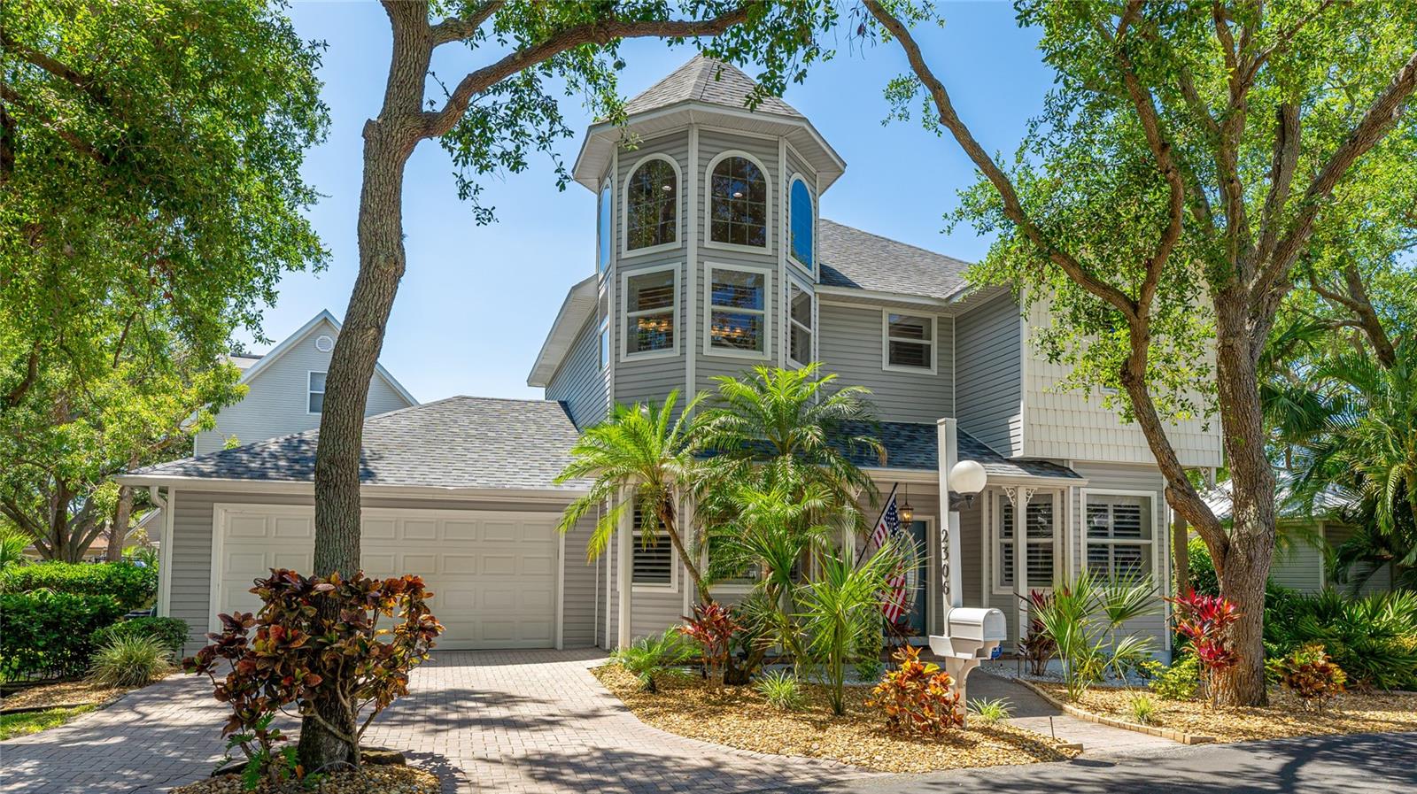 FIVE MILES TO THE PRISTINE BEACHES OF ANNA MARIA ISLAND! NO FLOOD INSURANCE REQUIRED!!!! A rare opportunity in the storybook setting of Cape Town Village! Originally built as the model home for this enchanting 42-home community, this residence is packed with custom touches and recent high-end upgrades. Nestled in a peaceful, wooded neighborhood filled with classic New England–style homes, Cape Town Village offers private, maintenance-free living just minutes from everything you need—and everything you love. Step inside and be welcomed by soaring ceilings in the living room, bathed in natural light filtered through stately oak trees. The home features brand-new hardwood floors throughout, plus new wall-to-wall carpeting in all three bedrooms. Deluxe Hunter Douglas plantation shutters grace every window, adding both beauty and privacy. The kitchen has been fully remodeled with sleek quartz countertops, a new sink, faucet, and disposal, and comes equipped with a full suite of Frigidaire Gallery appliances (2022): refrigerator, induction cooktop, oven, microwave, and dishwasher. Each of the three bathrooms has been thoughtfully updated with quartz counters, Kohler toilets, modern sinks, and faucets. Two guest baths feature designer grasscloth wallpaper, while the primary suite includes a fully reimagined walk-in shower with frameless glass doors and elegant tilework. Additional recent improvements include: Whole-house Culligan water softener, new Rheem hot water heater, 11 Minka Air ceiling fans, updated foyer and dining/bar light fixtures, new gutters with stainless steel leaf guards, professional landscape lighting, and a new ADT security system. Best of all, the HOA handles all the hard work for you—including ground maintenance, irrigation, cable TV, internet, and upkeep of the community pool, just steps away from your front door. Perfectly located in central Bradenton, you're just minutes from Blake Hospital, shopping, dining, downtown Bradenton, GT Bray Park, and only 5 miles from the pristine beaches of Anna Maria Island. This move-in-ready home offers timeless charm, modern comfort, and the ease of true maintenance-free living in one of Bradenton’s most idyllic communities.