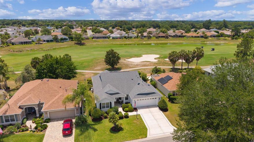 MOVE-IN READY Designer Golf Course Home in Prime Virginia Trace – Steps from Lake Sumter Landing!

Welcome to 1426 Honea Path, a beautifully maintained 3/2 Camellia (Gardenia) model in the highly sought-after Village of Virginia Trace. This expanded designer home sits directly on the 6th Hole of the Virginia - Mallory Country Club Championship Golf Course, delivering stunning golf course views from nearly every rear window. Enjoy peaceful fairway vistas, spectacular sunsets and wildlife — all from the comfort of your large air-conditioned Florida Room or the shaded pergola patio.

Located just a short walk or quick golf cart ride, only half mile to Lake Sumter Landing Market Square, this home offers the ultimate Villages lifestyle with dining, shopping, live entertainment, and waterfront activities right around the corner. Residents also enjoy quick access to the Canal  Street Recreation Center, community pool and postal station.

The home has been lovingly cared for with neutral paint throughout, knockdown ceilings, granite countertops, and newer stainless steel kitchen appliances. Other features include a spacious kitchen with pull-out cabinets and large pantry, volume ceilings, an open floor plan, wood plank laminate flooring in main living areas, tile in wet areas, and carpet in the primary bedroom.

The generous master suite features a large ensuite bath with dual sinks, granite counters, a walk-in shower, and dual walk-in closets, plus direct access to the Florida Room. Two guest bedrooms (one with a Murphy bed and built-in desk/cabinetry) provide flexibility. The expanded 2-car garage has ample space for 2 cars and golf cart parking as used by the current owners, a painted floor, workshop area, and solar attic fan.

Major value-adds include:
**Bond is fully PAID
**HVAC 2026, Smart Thermostat
**Roof replaced in 2020
**Water heater 2018.

Priced to reflect exceptional value for this golf course location and proximity to Lake Sumter Landing and all the amenities, this home is waiting for its next chapter. Don’t miss the opportunity to own a designer home in one of The Villages’ most convenient and desirable golf course neighborhoods.

Call us today to schedule your private showing!