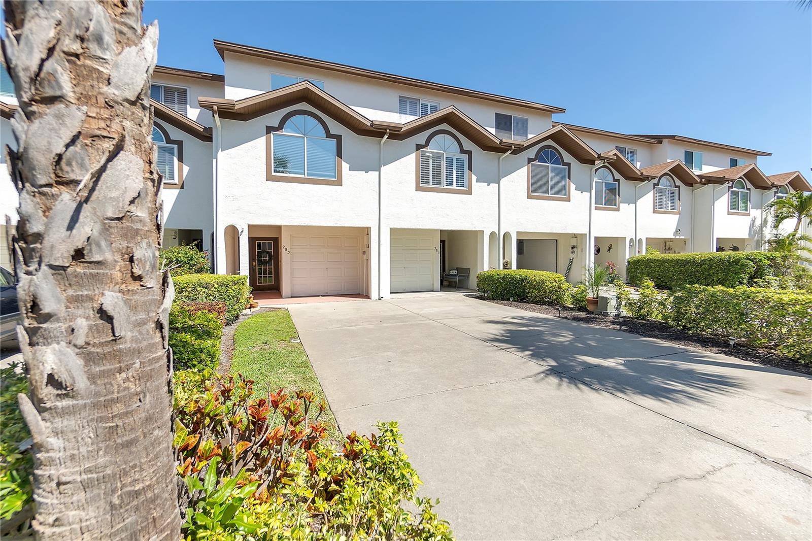 *NO flooding, flood damage or claims filed as result of hurricanes* If you are looking for an active lifestyle waterfront community then this is it! Tierra Verde is highly desirable for it's proximity to Fort DeSoto Beach, St. Pete Beach & Pass a Grille Beach. Ride your bike to happy hour at Billy's or Island Grill! This 3bd/3ba townhome located in the Palms of Tierra has been meticulously maintained by the original owner & just had a brand new HVAC/AC system installed. The kitchen/living/dining is an open concept style and each bedroom has it's own en suite bathroom with tile floors & tile showers. Vaulted ceilings and skylights bring in tons of natural light and the double balconies show off a peak-a- boo view of both Tampa Bay and recently renovated pickle ball/ tennis courts. Offering plenty of storage space, the extended tandem garage will easily fit 2 cars plus all of your adventure gear. This pet friendly community allows 2 large dogs(up to 100lbs each) and has plenty of resort style amenities such as a heated pool and spa, tennis/pickleball courts, fishing docks, a waterfront boardwalk and a fitness center. Your HOA fee also covers basic cable TV, internet, grounds maintenance and water/sewer/garbage. There isn't much more to do besides move in, as this unit can come fully furnished-turn key. Come live where others vacation, welcome home!