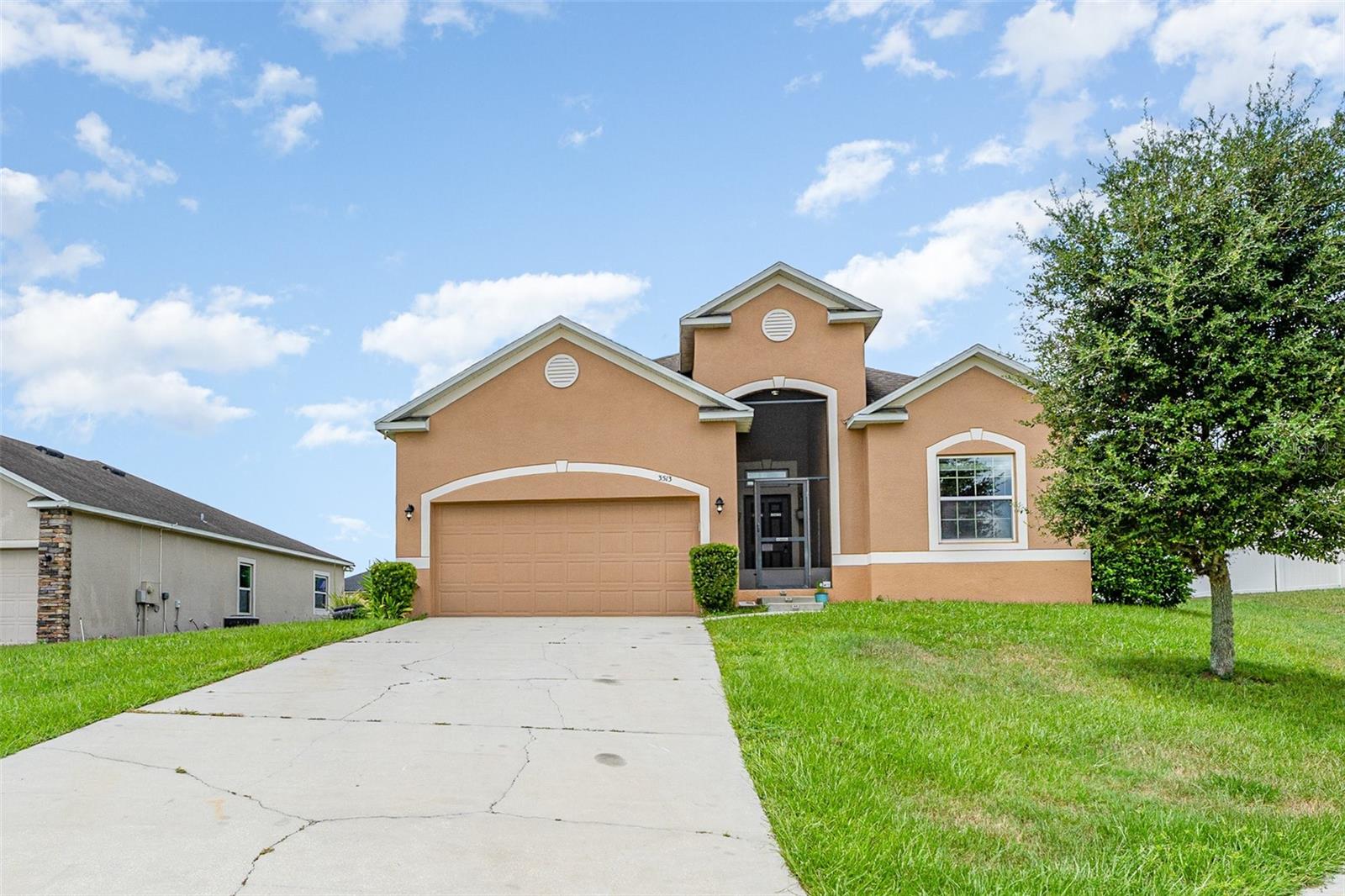 One or more photo(s) has been virtually staged. Welcome to Your Stunning 3-Bedroom, 2-Bathroom Home with a 2-Car Garage on a Spacious Corner Lot! With over 1,750 square feet of
heated living space, this home offers an open, flowing floor plan. Step into the expansive living room, seamlessly connected to the dining
area and kitchen, perfect for both relaxation and entertainment. The large kitchen features a welcoming breakfast bar. Throughout the
common areas, you'll find tastefully updated ceiling fans for a modern touch. The master suite offers a luxurious retreat with its own
en-suite bathroom, complete with a separate shower and tub for ultimate relaxation. Bedrooms closets comes with built-ins for organization
and ample storage space. From the convenience of your own home, step into your expansive screen-enclosed lanai, perfect for year-round
outdoor living and for hosting guests in comfort and style. Situated on a desirable corner lot, this home offers both privacy and
convenience. There are solar panels that are currently being leased and transferable which will convey with the property. Has a new AC installed May 2025.