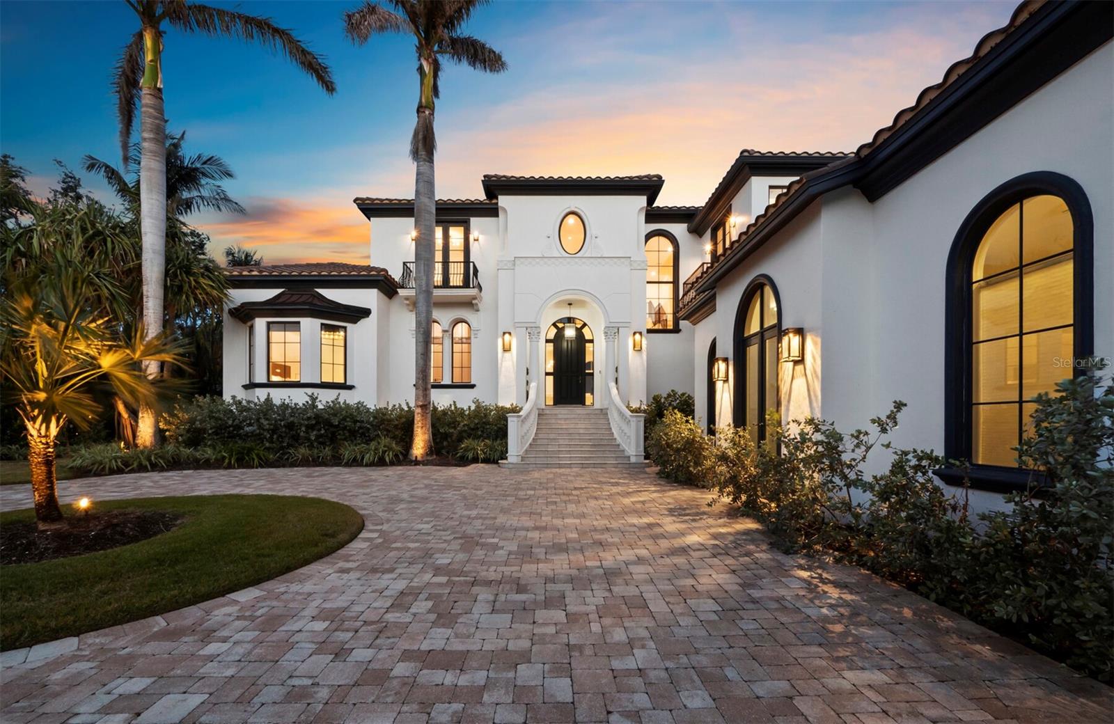 ACCEPTING BACK UP OFFERS. Sleek. Sophisticated. Effortlessly Luxurious. This completely reimagined Bay Isles Harbor residence is a stunning example of minimalist elegance, where clean lines, impeccable craftsmanship, and Restoration Hardware’s exquisite furnishings create a space that blends everyday comfort with innovation. Step inside to an open, airy layout filled with natural light, where each detail from designer lighting to high-end appliances has been meticulously selected for beauty and function. Spanning 6,556 square feet of living space on an oversized corner lot, the home’s interior features four expansive bedrooms, a study, executive office, a state-of-the-art fitness room, golf simulator and three car garage with private back entrance. The true showstopper? Your outdoor oasis, where an infinity-edge pool melts into the waterway, creating a mesmerizing fusion of sky and sea. From hosting friends to savoring a quiet sunrise, every inch of this home is crafted for the extraordinary. With your boat privately docked just behind your home, adventure is always within reach whether it’s a quick cruise to a waterfront restaurant or a sunset sail on the Bay. Beyond the privacy of Bay Isles’ gated community, the best of Longboat Key is just minutes away. Indulge in world-class amenities at the new St. Regis Resort, or stock up on essentials at Publix in Bay Isles all effortlessly convenient. For beach lovers, exclusive access to the Bay Isles Beach Club or the Longboat Key Club (with membership) ensures that pristine white sands are never more than five minutes from your door. Every inch of this home is gorgeous, curated, and move-in ready offering a sophisticated waterfront lifestyle that is truly unmatched.