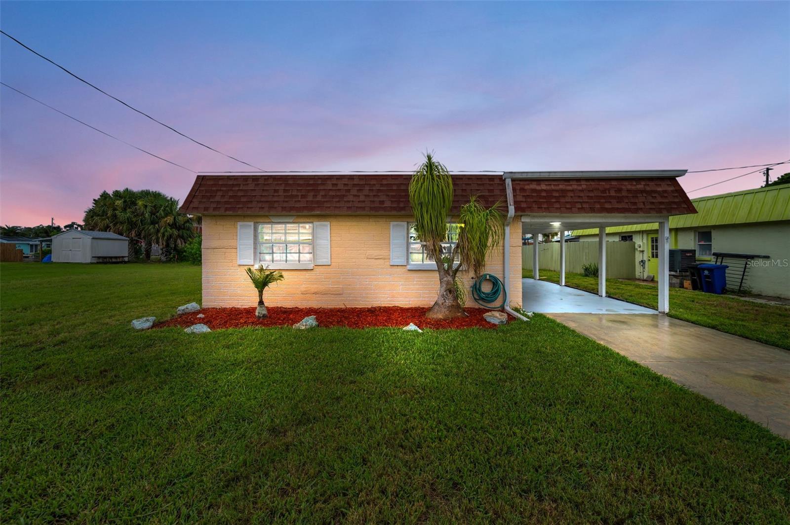 COASTAL PARADISE - Light & Bright and Just Right! Newly remediated/renovated with a Licensed General Contractor and County permits.
This adorable home has direct Gulf Access without bridges and features 2 Bedrooms, 1 Bathroom, covered carport, an open plan with higher ceilings, recessed can lighting, thermal/double pane windows, ceiling fans, and wood plank look ceramic tile flooring (except 2 bedrooms have other ceramic tile), and a soft, soothing coastal color painted throughout. As you step inside you can feel the spaciousness and see the sparkle of everything new! The gorgeous new kitchen boasts shaker cabinetry, quartz counters, stainless steel appliances, French door refrigerator with bottom freezer drawer, under cabinet lighting, a cook top with a stylish stainless steelrange hood and an abundance of counter space. Adjacent to the kitchen is the laundry room which includes a new stackable washer & dryer and has a door to access outside. Both Bedroom entrances are at the end of the hallway where the main bathroom is located. The main bathroom is a stunner with raised panel cabinetry, quartz countertop and undermount sink, walk-in shower with recessed shampoo shelves, rain shower head and a hand held shower head, glass enclosure and linen cabinet. The East facing screened back porch is serene and perfect for morning coffee and to welcome a new day with the sunrise. PLUS, there's more.....NEW CONCRETE SEA WALL 2019, ROOF 2015, A/C 2014. Superb location with access to I-75 and the Suncoast Parkway (589) via State Road 52. Close to restaurants, shopping, parks, beach, medical, and more.