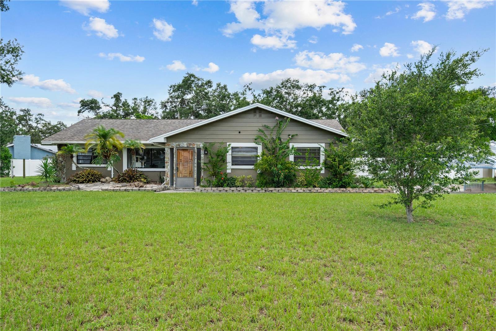 Perfect Starter Home with Endless Potential – 3 Bed, 2 Bath Pool Home on ½ Acre in Brandon, FL
This is a remarkable opportunity to make your dream home a reality! Whether you're a first-time buyer or looking for the perfect family starter home, this spacious 3-bedroom, 2-bathroom pool home offers space, function, and flexibility on a ½-acre corner lot in the heart of Brandon.
Step inside and discover a home designed for both everyday living and entertaining. With a large family room featuring a stunning stone fireplace, formal living and dining areas, and a bonus room perfect for a home office or playroom, there's room for everyone to spread out.
The kitchen is a standout, offering Corian countertops, ample cabinetry, and a custom dining island, ideal for family meals or hosting friends. French doors lead out to the expansive screened lanai and covered pool area, complete with an outdoor kitchen – your own private oasis for weekend BBQs or relaxing poolside evenings.
Outside, the perks continue with a fully fenced yard, lush landscaping, a greenhouse, and a 30x18 workshop/garage with 30 AMP service, plus a 20x21 lighted carport. RV and boat owners will appreciate the ample parking and electric and water hook-ups. No HOA or CDD fees!
While the home needs some TLC, it’s priced with that in mind and is being sold AS-IS. Perfect for buyers looking to build equity with a little vision – a renovation loan could be a great option. Roof is under 10 years old, pool needs to be redone!
Bring your ideas and make this one your own. Homes with this much space and potential don’t come around often – schedule your showing today!
