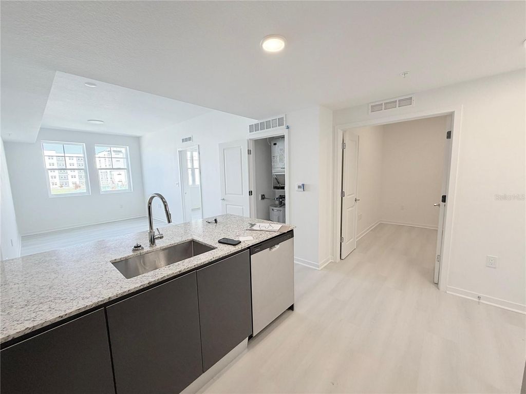 Photo of 5587 Millenia Park Blvd, Unit 221, Orlando, FL 32839 (MLS # S5143087)