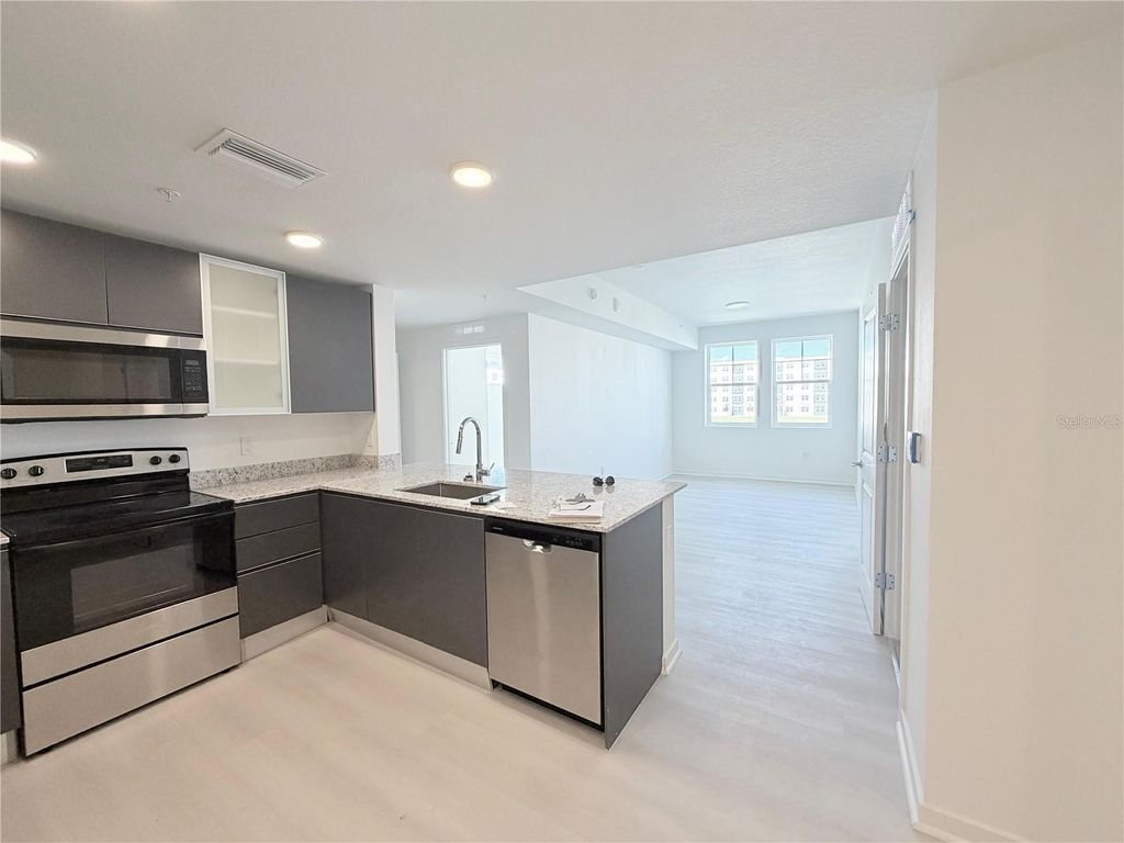 Photo of 5587 Millenia Park Blvd, Unit 221, Orlando, FL 32839 (MLS # S5143087)