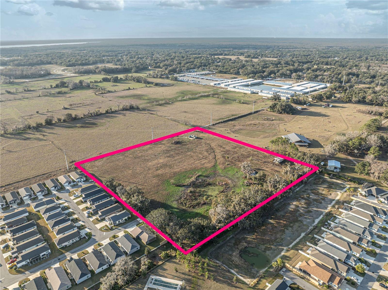 Positioned right next to The Villages—the nation’s fastest-growing and largest single-site development—this 10-acre parcel is ripe for transformation. Once considered a rural outpost, the upcoming realignment of US Hwy 301 now places the property at the gateway to a major highway, ushering in unprecedented growth potential. Surrounded by thriving businesses such as climate-controlled self-storage, covered RV storage, warehouse flex space, churches, and vibrant single-family developments, this site benefits from a diverse mix of neighboring uses and zoning that spans industrial, residential, institutional, and commercial categories.Seize the opportunity to invest before the realignment takes effect and property values soar. Call or email today for more information!