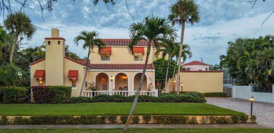 Celebrate Venice’s Centennial in an original 1926 residence, thoughtfully preserved and updated within the Venezia Park Historic District, which is listed on the National Register of Historic Places and recognized as home to the most significant collection of historic homes in Venice. One hundred years later, it stands as one of the finest examples of what thoughtful preservation and modern restoration can achieve, a true Centennial home, impeccably updated and move-in ready. This is not a home that asks you to compromise. The character of 1926 is all here and so are the finishes, systems, and details of 2026. This home is designed to embrace the Florida lifestyle. A covered loggia with pecky cypress ceiling, graceful arched openings, and a classic balustrade announces the home's arrival before you even step inside. Through the original glass-paned front door, the interiors unfold with warmth and intention. Original heart of pine floors refinished to a rich, warm luster extend throughout the first floor. Arched openings, original interior doors, custom period casings, and French doors with glass hardware speak to a level of craftsmanship rarely encountered. Vaulted, beamed ceilings and an original brick fireplace anchor the living room, where natural light pours through updated windows dressed in plantation shutters. Period style sconces and light fixtures carry the aesthetic through the formal dining room, which opens via French doors to an enclosed lanai and its garden views beyond. The kitchen is the rare kind that honors its context without sacrificing a thing, floor to ceiling natural cherry cabinetry, stone countertops, and modern appliances all selected to complement the homes architectural period. A first-floor bedroom and fully updated bath showcase black and white tile, a pedestal sink, original honeycomb tile flooring, and a beautifully refinished cast iron bathtub. Upstairs, the original wood staircase leads to two bright bedrooms and a second full bath, each finished with the same cohesive, period-appropriate care, including original narrow plank oak floors and another refinished cast iron tub. A detached guest house completes the picture a private, fully equipped retreat with kitchenette, full bath, and walk-in shower, ideal for guests or multigenerational living. A paver patio connects the two structures, creating a seamless outdoor living space framed by mature, established landscaping. The structure - solid, updated, and worry-free. The home has been comprehensively improved beneath its beautiful surface: full plumbing replacement with new PVC lines throughout, a three-zone air conditioning system with entirely new ductwork (2019), a new water heater (2026), roof replacements on both the main residence (2010) and guest house (2023), and a hurricane-rated privacy wall (2014). These are not deferred items — they are done. The location is the final grace note. Historic downtown Venice its charming boutiques, acclaimed restaurants, galleries, theaters, and parks are just a short walk from the front door. With the Gulf never far, the island’s pristine beaches are and easy walk, bike ride, or quick drive from your front door, just the way life on Venice Island was always meant to be.