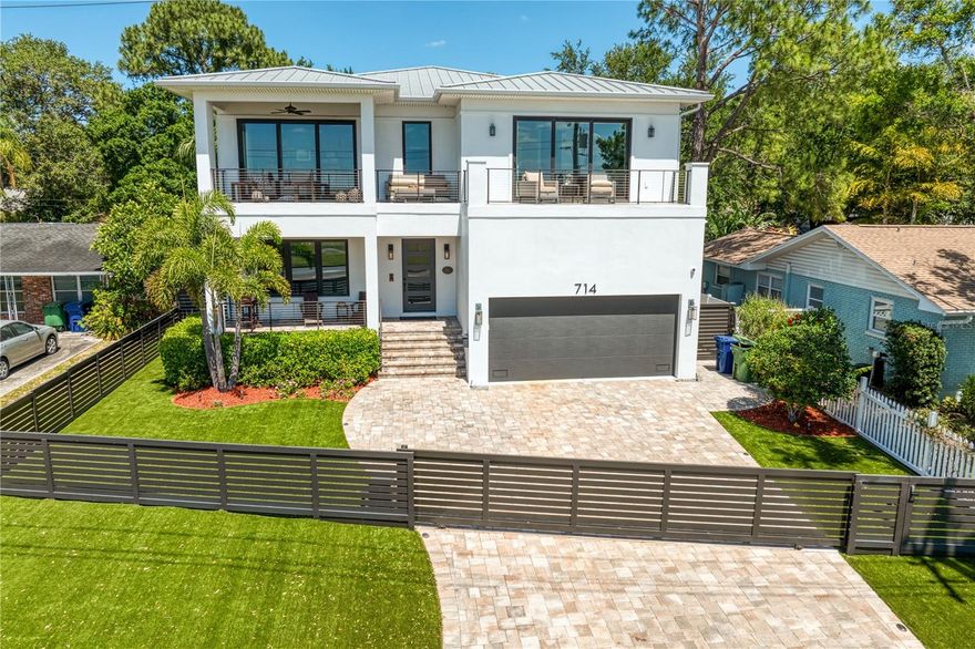 Spectacular Davis Islands contemporary home filled w/custom options and upgrades. This 2018 built, 4-bedroom, 4.5 bathroom pool home has unbelievable water views! Watch the cruise ships & private planes from both of the balconies and the many windows throughout this Western facing property. Devonshire Home's constructed, 2-story block construction home w/metal roof has nearly 4,400 square feet of living space. First floor layout includes a large great room, enormous gourmet kitchen, formal dining or living room, mudroom, under stairs storage closet, powder bath and guest bedroom w/en-suite bath which also doubles as the pool bath, center located staircase w/custom railing and large sunny dining space w/view of pool. Second floor layout includes; Primary bedroom/bathroom, den/office/bonus room, loft, two additional bedrooms w/en-suite bathrooms, large laundry room and two additional storage closets. Some entire home features include; wood floors, crown molding, 7.25” baseboards, custom roller shades, ceiling fans and designer light fixtures, hurricane rated sliders and windows w/solar shades, Elan smart home automation system and whole-house Generac gas generator. Highlights include; a beautiful gourmet kitchen w/tons of 42” shaker cabinets w/ceiling high uppers, center Island w/large breakfast bar, quartz countertops, subway tile backsplash, GE Monogram stainless steel appliances w/gas cooktop and double oven, wine refrigerator, under cabinet lighting and huge walk-in pantry. Both the primary bedroom and den have observation decks/balconies w/unobstructed views. Luxurious primary bathroom w/custom tile floors, free-standing tub, frameless shower, dual sinks, quartz countertops and enormous 20x11 primary closet w/island. This home has a fabulous private outdoor space those features include; Pavered rear covered patio w/summer kitchen and motorized screens, refreshing heated salt-water pool w/sunshelf and spa and pavered pool deck, fenced backyard w/front and back custom lighting and landscaping, irrigation system, front and rear synthetic turf for easy maintenance, extra wide pavered driveway for parking of multiple vehicles with a contemporary metal fence and electric gate. Other helpful highlights include; electric car charging outlet, two tankless water heaters, walk-in closets w/custom shelving in all bedrooms, remote control blinds and so much more. World famous Davis Island has top rated schools and tons of community amenities including; a golf cart designated community, community pool and tennis facility, marina, boat ramp, dog park/beach, playground, beach, little league fields and the Davis Island Yacht Club and plenty of shops and restaurants to enjoy. Only minutes from TGH, UT, Riverwalk, Waterstreet, Amalie Arena, Channelside and TIA w/easy access to major highways. Gorrie/Wilson/Plant