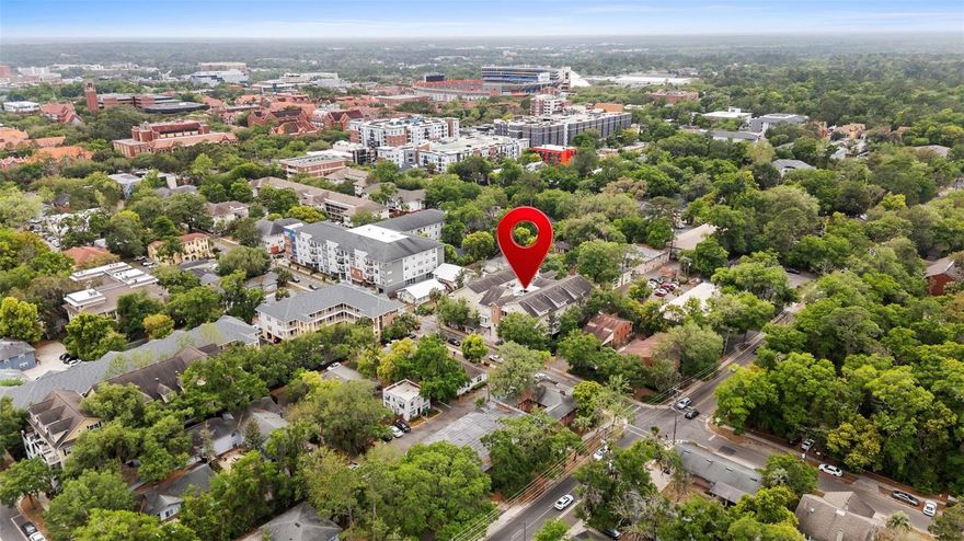 Rare 1-bedroom, 1-bathroom floor plan just steps from the University of Florida! This upscale condo offers high ceilings and an airy, open layout, with a private balcony off the living area that fills the space with natural light. The upgraded kitchen features granite countertops, modern appliances, and a convenient breakfast bar—perfect for both everyday living and entertaining. Enjoy durable wood-look plank flooring and tile throughout, with no carpet for easy maintenance. Located in a secure building with controlled access, residents benefit from key fob entry, elevator code access, and one assigned parking space in the ground-floor garage. Ideally situated STEPS AWAY to UF campus, Midtown dining, and the football stadium, this property is perfect for both homeowners and investors seeking a prime location.