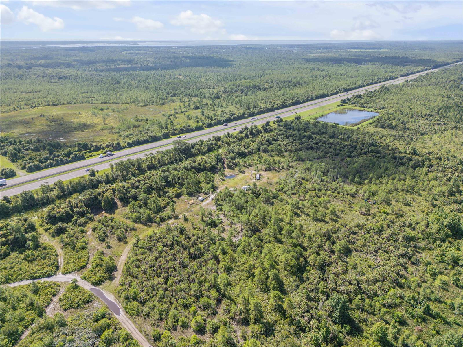 Discover 4 parcels totaling 10.31 acres of untouched Florida wilderness in Volusia County’s Resource Corridor (RC) zoning. This is a rare opportunity to own land focused on preserving natural beauty and habitat, ideal for land banking or a secluded recreational retreat.
Surrounded by the future Farmington / Deering Park communities, the property offers prime positioning without HOA restrictions. Access is gated and permitted by request via an unpaved road, best reached by four-wheel drive. No named road or utilities currently exist, maintaining its raw, natural character.
Current zoning supports low-intensity use and environmental preservation, offering long-term potential in a rapidly growing area.