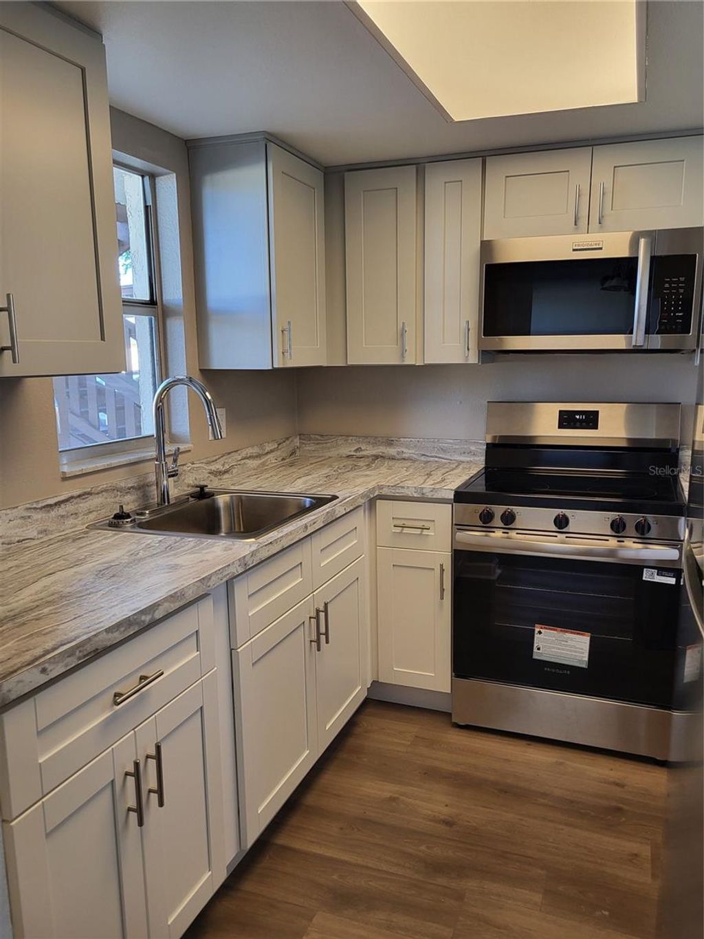 Photo of 4956 Harbor Villa Lane #103, New Port Richey, FL 34652 (MLS # W7883943)