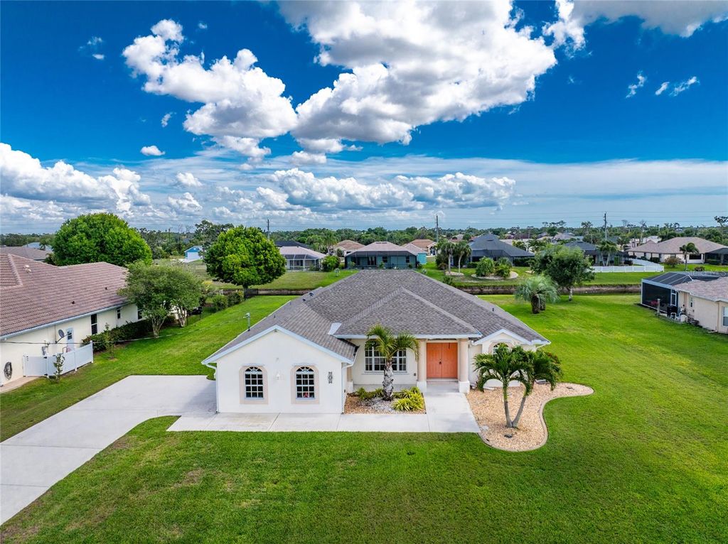 Photo of 438 Boundary Boulevard, Rotonda West, FL 33947 (MLS # D6146843)