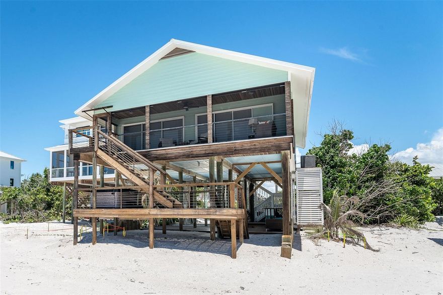 Welcome to your Gulf-front escape on Don Pedro/Palm Island in Placida, Florida—where elegance is effortless and every day ends in a sunset.
Recently improved in price, this move-in ready beachfront home is a rare opportunity to step into true coastal luxury on a private, bridgeless barrier island—accessible only by ferry or boat. Translation: peace, privacy, and zero chaos. Inside, it’s all clean lines, soft coastal tones, and sunlight pouring through walls of sliding glass. The open kitchen, dining, and living spaces are designed for easy entertaining—or a quiet night in with a glass of wine and the Gulf as your backdrop. Two spacious en-suite bedrooms deliver spa-level comfort with oversized walk-in showers and elevated finishes. Outside is where the magic happens—morning beach walks, afternoon shelling, sunset cocktails in your private Gulf-front hot tub. This is the kind of place where time slows down and life feels exactly right. Community perks include a pool, tennis, and first-come boat dockage. Perfectly positioned between Boca Grande and Englewood, Florida, yet a world away from everything. This isn’t just a home—it’s your reset button, your retreat, your reward for doing life well.