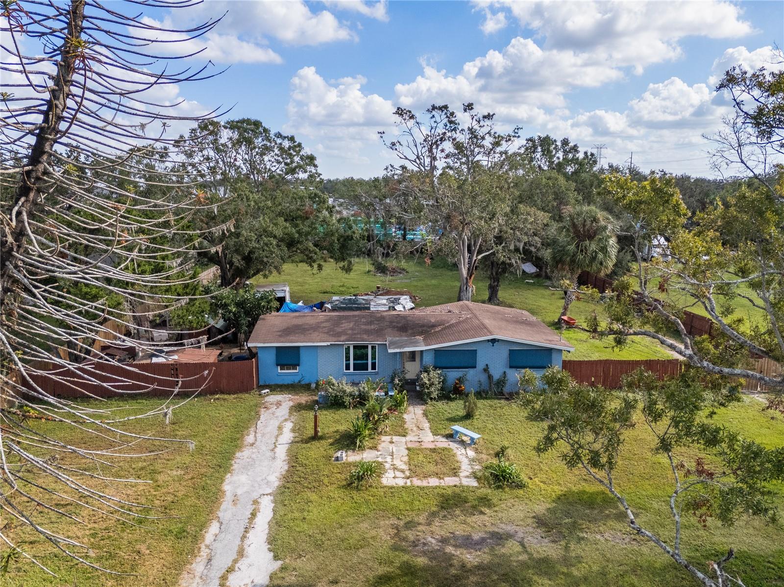 This awesome redevelopment opportunity knocks in an amazing location!!! Looking to relocate or expand your business? This is an open slate in an amazing location! This property is located less than a 1/4 mile south of Palm River Rd on south 82nd St. Easy access to all of the major interstates and highways! Less than 5 min to Selmon Expressway and Hwy 301, and less than 10 min to I-75, I-275, I-4, and Hwy 41. It also a quick 15-minute trip to the Port of Tampa and the CSX Adamo Rail Terminal, and 30 minutes to Port Manatee.
Currently zoned (AS-1) for up to 3 farm animals, including horses and allows for limited commercial uses. It will require re-zoning to reach its full potential as this is the last residential property in an area that has converted to commercial and industrial properties. .99-acre lot on with a 4/1 1398 sqft concrete block home. Concrete block construction with an approximate 12-year-old roof. The property is on well and septic. The septic tank was replaced approximately 8 years ago. City of Tampa water and sewer available nearby. This would be a great location for a small distribution/service type company. The zoning MAY be able to be changed, as it is adjacent to properties that have changed to a PD allowing for industrial uses. Other properties on the street have converted to CG and BPO zoning. The future land use code is currently CMU-12.
All appliances, including the 3 chicken coops convey, and approximately 54 chickens also convey if desired.