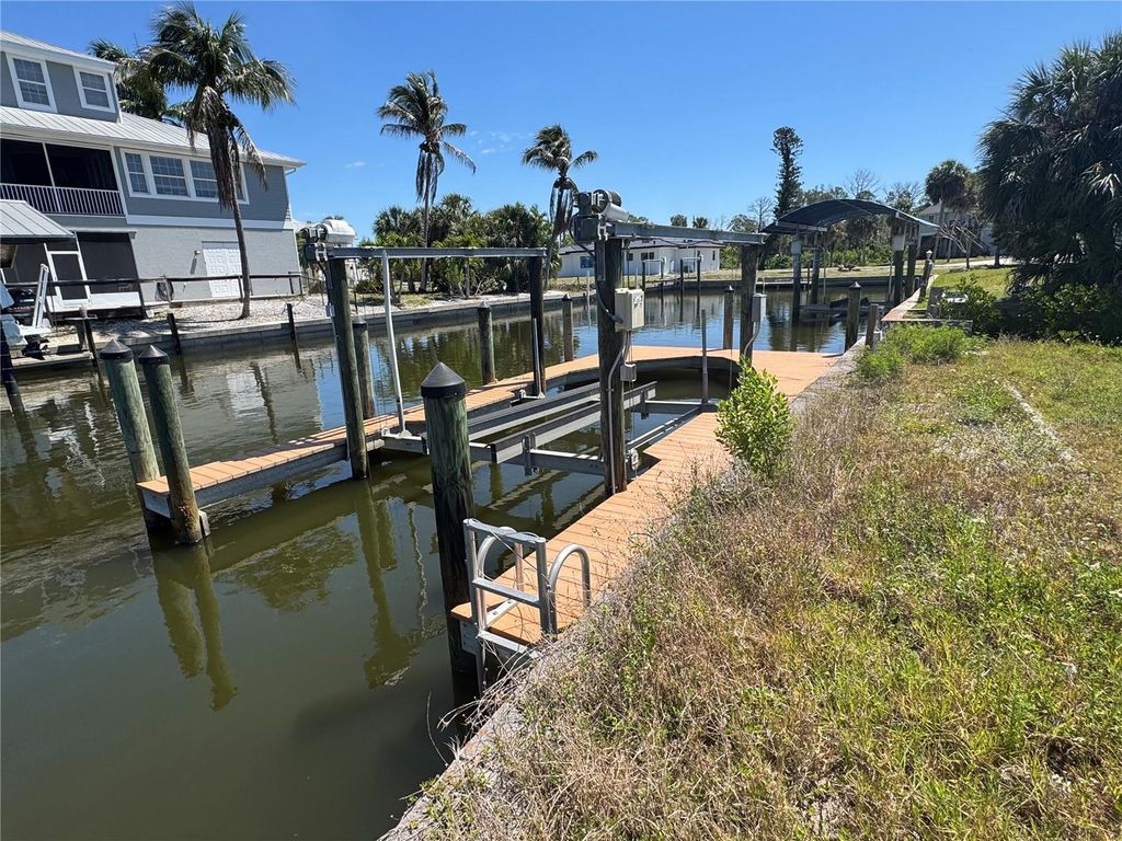 Photo of 24360 Blackbeard Blvd, Punta Gorda, FL 33955 (MLS # C7525248)