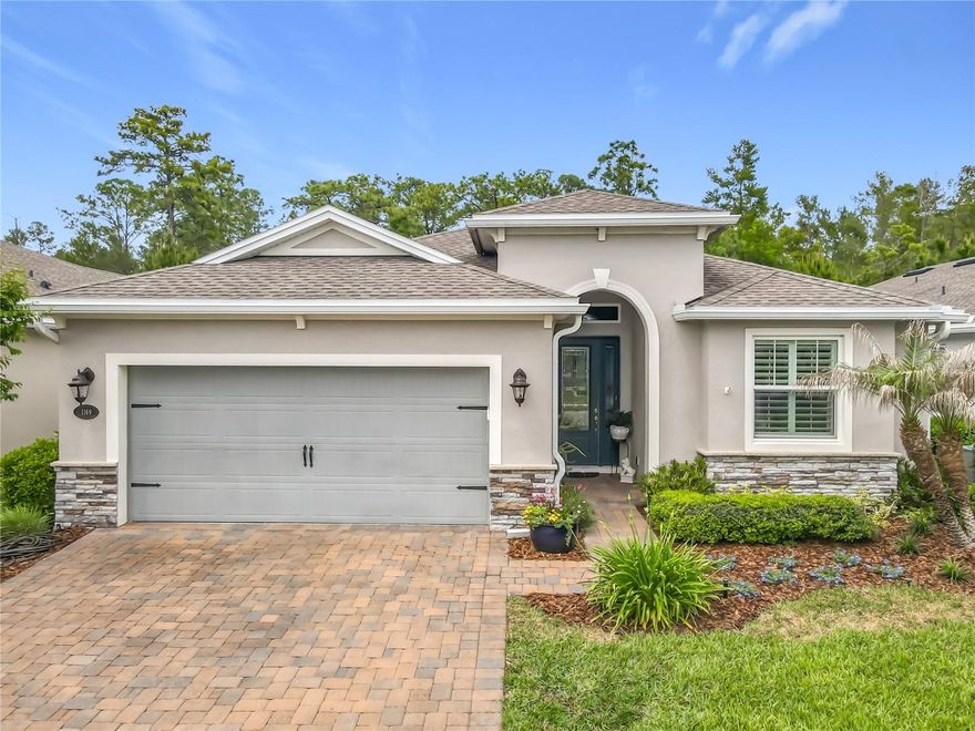 Welcome to Deland’s premier 55+ community of Victoria Gardens. This highly sought after floor plan (3 Bedroom/3 Bathroom/Flex room) is one of the few homes that backs up to the Lake Moore Conservation Area, which enhances the peaceful view of the landscaped and fenced backyard garden. The details make this home stand out, including crown molding in most spaces, 5” baseboards, chair railing in living/dining areas, quartzite countertop island, tray ceilings, high ceiling height with extra tall doors, custom drapes/roll down shades/shutters and newly painted interior designer palette. This light and bright home offers all of the best – the large gathering space and kitchen for every need opens to the expanded paver lanai, the split floor plan includes a guest bedroom with its own en suite bath and third guest room beside the third bath, while the center of the home features a double door office/hobby/den flex space. Plenty of storage with the oversized primary closet, extensive kitchen with 42” cabinets, pantry, three linen/storage closets, laundry room cabinetry and mounted garage storage platform. In addition to the wonderful community of neighbors, Victoria Gardens HOA covers gated entries, high speed internet, cable TV, irrigation, and all the amenities (clubhouse, restaurant and bar, pool and spa, fitness center, tennis/pickleball, billiards, craft room, ballroom hosts live entertainment and game nights, clubs for everyone, etc.). Close to quaint Downtown Deland, restaurants, healthcare, shopping, Stetson University, and I-4 access, which take you anywhere! (And, more specifically, 30-60 minutes to Daytona or Orlando!)