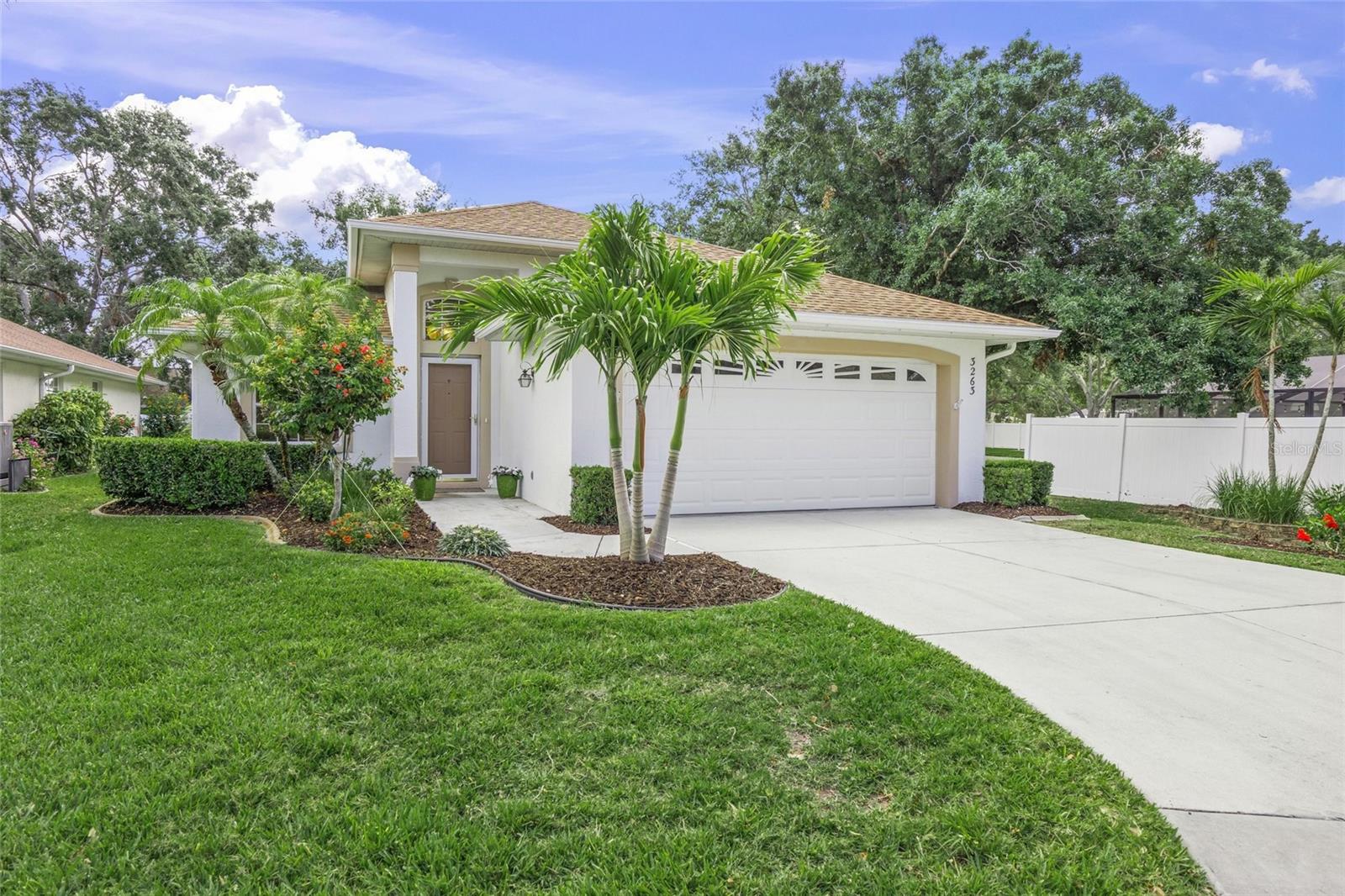METICULOUS, stylish 3 bedroom, 2 bathroom home in A-rated school district and the maintenance-free Boutique community of ASHLEY OAKS. Situated down an Oak-canopied street to this Cul-de-Sac location the landscaping of this home strikes one immediately with its sumptuous greenery, flowering trees and mature shrubbery. Inside, the gourmet kitchen footprint incorporates snow toned wooden cabinetry, expansive pantry, recessed lighting, breakfast counter seating and stainless steel appliances. A versatile Great room, in both size and location, offers scenic viewing or enter the Lanai and rear yard through the triple panel glass doors. All Bedrooms feature wood styled laminate flooring, are generous in size and the 16’x12’ master suite is privately positioned in this split bedroom plan with en-suite bath, walk-in closet, and slider access to the Lanai as well. Gorgeous imported Italian tile highlight the common areas, baths, laundry and lanai and present the opportunity for easy upkeep and home care. Newly painted interior with designer colors, voluminous ceilings, contemporary flair ceiling fans and upscale lighting A two car garage with custom built shelving cabinets offers a definitive space for extra storage and organization while the inside utility/laundry is suitably positioned to accommodate a busy life style. A new roof 11/2019 and new HVAC unit 5/2021 minimize monthly energy costs. A short walk from the Cul-de-Sac sits the Clubhouse and heated pool, offering exercise, family fun, entertaining and cultivating new friendships. Centrally located to all conveniences; Detweiler's, CVS, Publix, Gulf Gate's Library Churches restaurants and shops, Costco, Target, Red Bug Slough Park and Siesta Key Beach are all nearby. Exterior was painted 2023. Vinyl fencing on the community's border is owned and maintained by neighboring Gulf Watch. Low HOA fees of $296/mo include management, landscape services, pool, clubhouse, common grounds and common elements. Make your appointment to see this beautiful, sparkling GEM today!!!