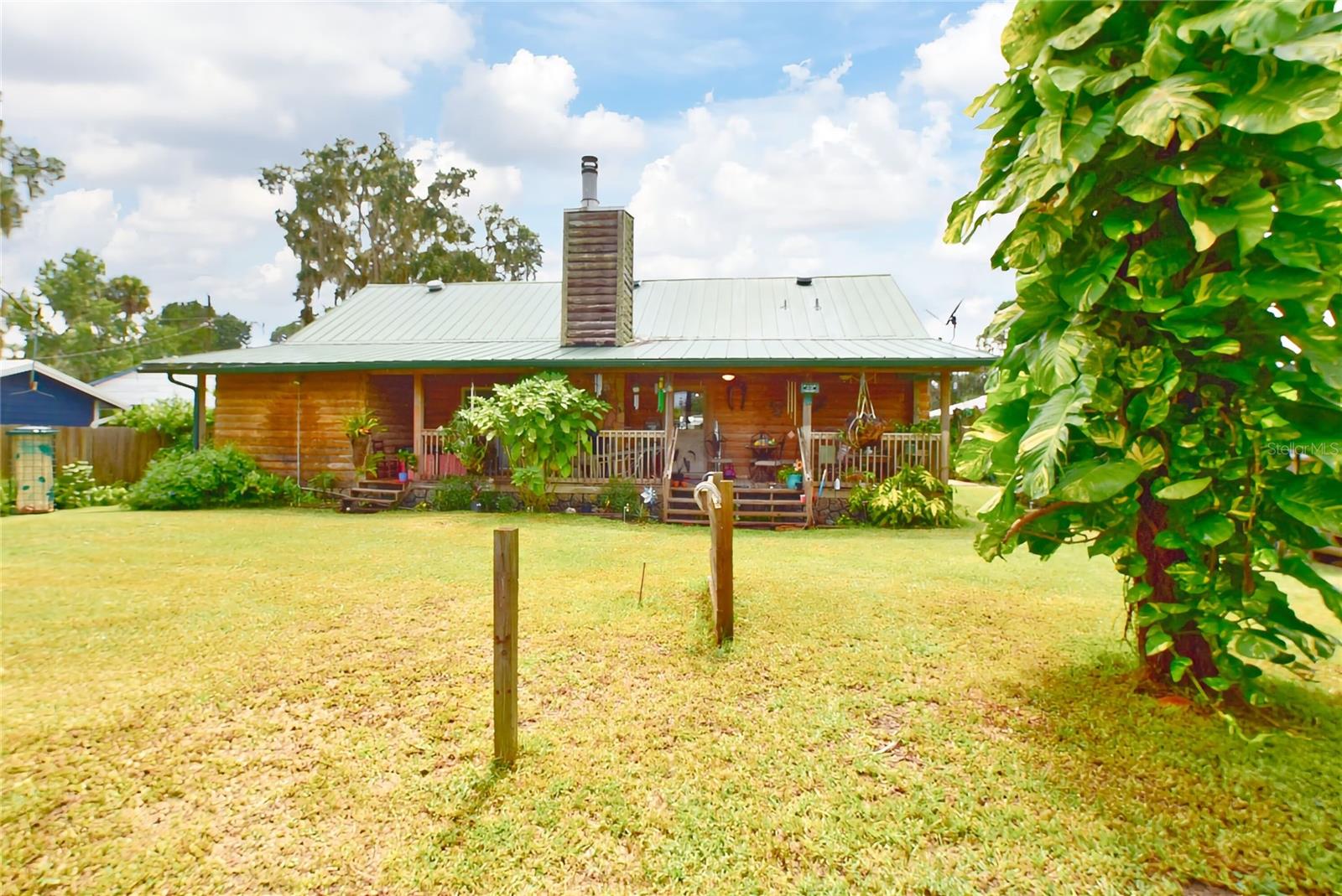 MOTIVATED SELLER!!! CANAL FRONTAGE!!CUSTOM BUILT BY OWNER!!!LOG HOME These are a few of my fav-or-ite things! 2/2 Log Home , Split Plan, Gigantic Walk-In Closet Extra Big Inside Laundry, High Ceilings, Fireplace, Custom Cabinets, so much more! Interior giving the warm feeling only Nature can bring! 1/1 unattached (480 sq. ft. not incl. in home sq. footage) PERFECT for Guest House, MIL Quarters or Rental~~Just a few minute boat ride and YOU ARE THERE....LAKE GEORGE!!! the 2nd largest Lake in Florida! Property Located in Beautiful Salt Springs, in the Ocala National Forest. Front and Back Porches give you that peaceful easy lifestyle for Full Time Resident, Part time, or Rental Opportunities~ WOOD FENCE * RETAINING WALL * BOAT HOUSE * WOOD DOCK/DECK! Most Custom/Wood Furnishings included!!
Optional $100 yearly for use of club private boat ramp. This is a must see~ Make appointment for private showing.