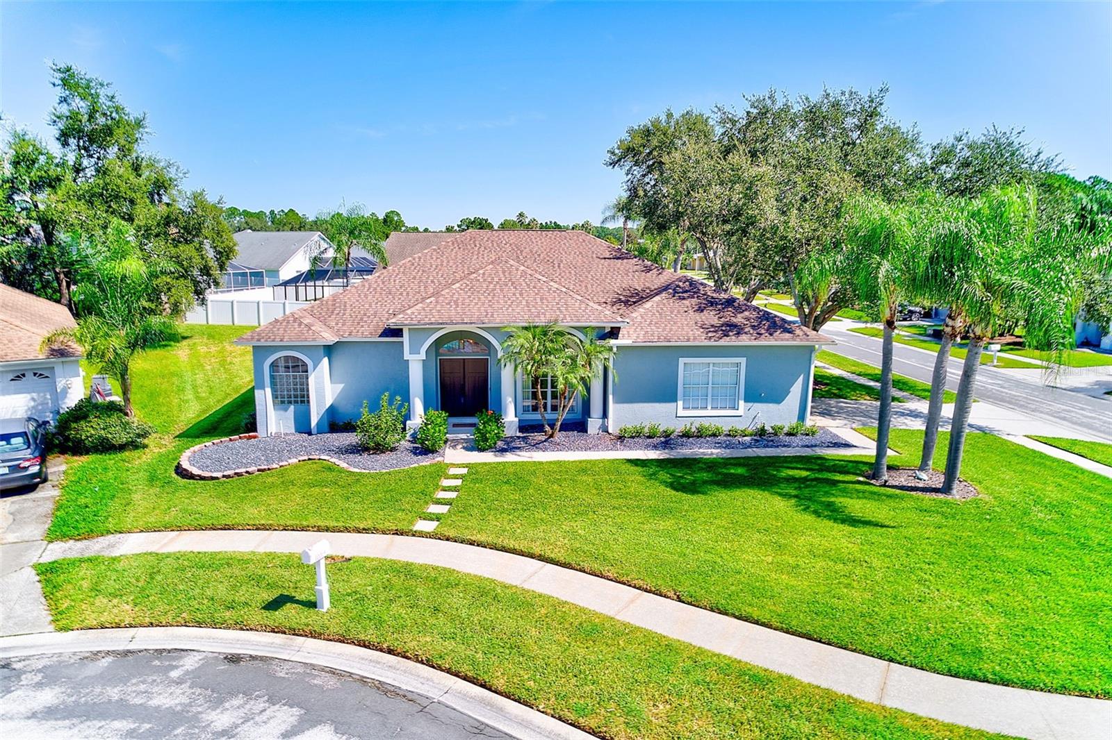 Welcome to this beautifully remodeled 4-bedroom, 3-bath, 2-car garage pool home in Tampa’s sought-after Pebble Creek community. Perfectly positioned on a lush corner lot, this single-story residence showcases a thoughtfully designed split floor plan with formal living and dining areas, along with a spacious family room featuring a cozy woodburning fireplace.
Extensively updated over the past few years, the home blends modern style with comfort. The gorgeous kitchen (2022) offers quartz countertops, plentiful cabinetry, and an expansive pantry area that provides exceptional storage—perfect for everyday living or entertaining. Throughout the home you’ll find luxury vinyl plank flooring, with the bathrooms and wet areas finished in beautiful tile. The primary suite is a true retreat, offering direct pool access, a spa-inspired bathroom with double vanities, a free-standing tub, a separate walk-in shower, and a large custom walk-in closet.
Walls of sliding glass doors in the family room, living room, and primary suite open directly to the lanai, creating seamless indoor-outdoor living. Outside, the pool was resurfaced in 2022, and the screened lanai cage was also rescreened that same year. A large covered area provides the perfect spot for dining, lounging, or entertaining while enjoying the sparkling pool and private backyard oasis. The updated pool/guest bath adds convenience for outdoor living.
Additional updates include a brand-new AC (2025), hot water heater (2024), roof (2018), and a striking double front door that sets the tone for the home’s stylish entry.
Pebble Creek offers wonderful community amenities, including pools, tennis and basketball courts, and playgrounds. All of this, with the convenience of nearby top-rated schools, shopping, dining, and major highways for an easy commute.