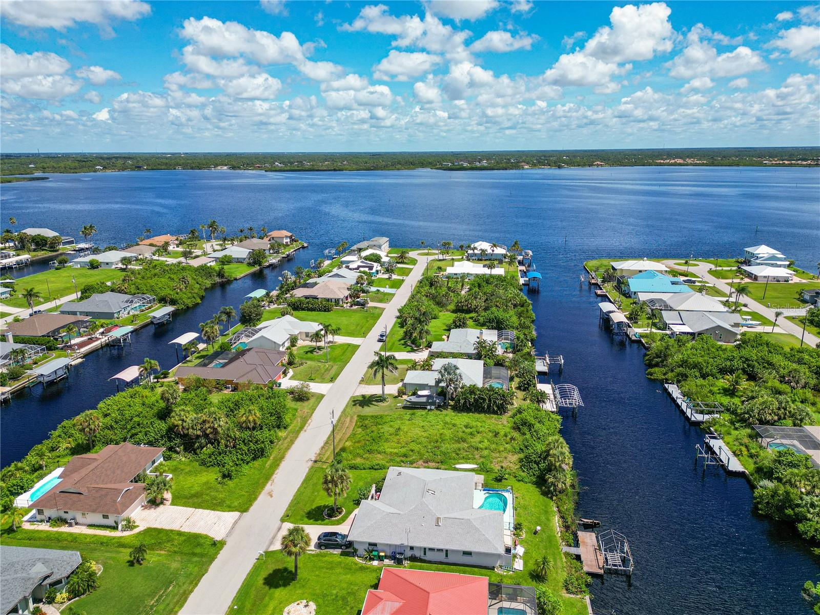 Ready to skip the land clearing process and build your DREAM HOME? This this nearly cleared, waterfront lot offers 80 feet of canal frontage with direct access to Charlotte Harbor. The land only has minimal grass cover, saving you $7,500+ on clearing costs and letting your plans go from paper to reality much quicker. Optional membership in the South Gulf Cove Property Owners Association gives residents access to a private boat ramp, community pavilion, and social activities. Closely located near golf courses, shopping, dining, healthcare, and public boat ramps, plus only minutes from Southwest Florida's iconic beaches! Picture your own boat dock, quick harbor access, and evenings spent dockside watching the sunset. If you want to get your plans started soon, we have a local builder ready to turn your vision into a waterfront reality.