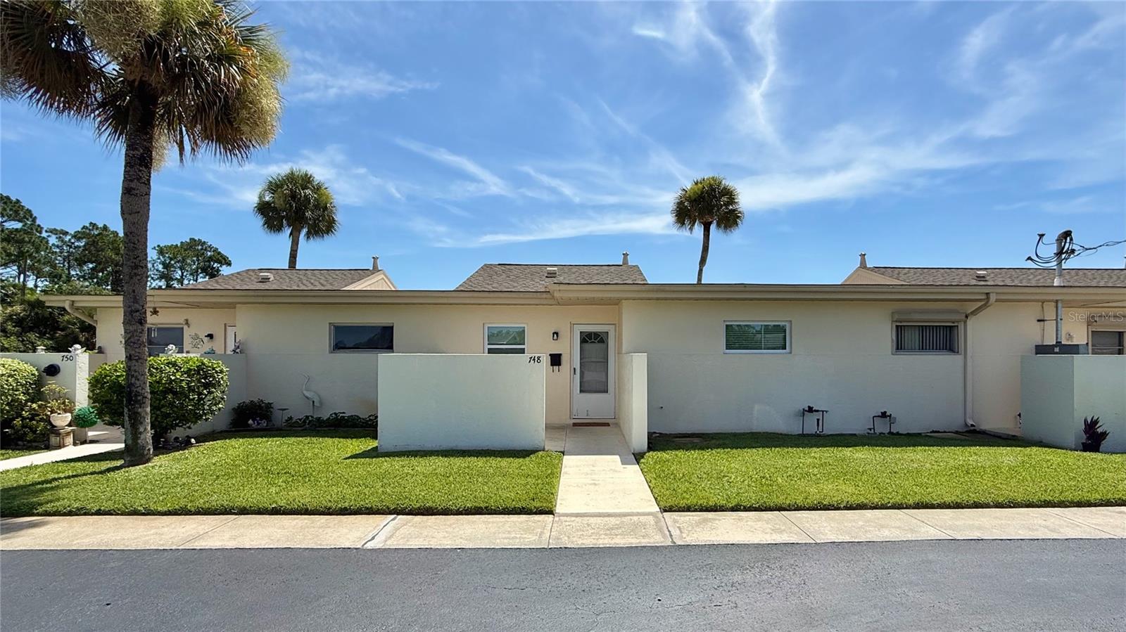 Enjoy the peaceful, low-maintenance lifestyle you've been searching for in this beautifully updated and fully furnished 2-bedroom, 2-bath condo, located in the well-kept 55+ community of Beach Club Colony in Lehigh Acres. Backing up to a tranquil freshwater canal with a private seawall, this move-in-ready home offers peaceful water views and a rare sense of privacy and relaxation. Inside, you'll find a bright and open layout with tile flooring throughout the main living areas and laminate in the kitchen and foyer. The kitchen has been tastefully renovated with newer cabinetry and stainless steel appliances, providing a clean, functional layout for everyday living. Both bedrooms are generously sized with ample closet space, and the bathrooms, while original, have been well-maintained and are ready to enjoy as-is. Step outside to your open-air rear lanai, a quiet spot to enjoy morning coffee or evening breezes. With association approval, the lanai may be covered or enclosed to expand your living space. The unit also includes a 4-year-old HVAC system for year-round efficiency and comfort, one assigned parking space, and ample guest parking nearby for visitors. The monthly condo fee of $385 covers a comprehensive list of services: exterior building maintenance, insurance, lawn care, community pool access, laundry facilities, professional management, and reserves. This low-maintenance structure allows you to lock up and travel with confidence. Beach Club Colony is a quiet, friendly community offering a community pool, common laundry facilities in each building, and a relaxed, neighborly feel. You’re just minutes from shopping, dining, medical centers, and several nearby golf courses. For added lifestyle appeal, the Gulf Coast’s world-renowned beaches, JetBlue Park (Spring Training home of the Red Sox), Hammond Stadium (Twins), I-75 access, and Southwest Florida International Airport (RSW) are all just a short drive away. Whether you're ready to simplify full-time living or enjoy winters in Florida, this move-in-ready condo offers comfort, convenience, and value in one of the area’s most accessible 55+ communities. Easy to show and available for immediate occupancy—schedule your private tour today.