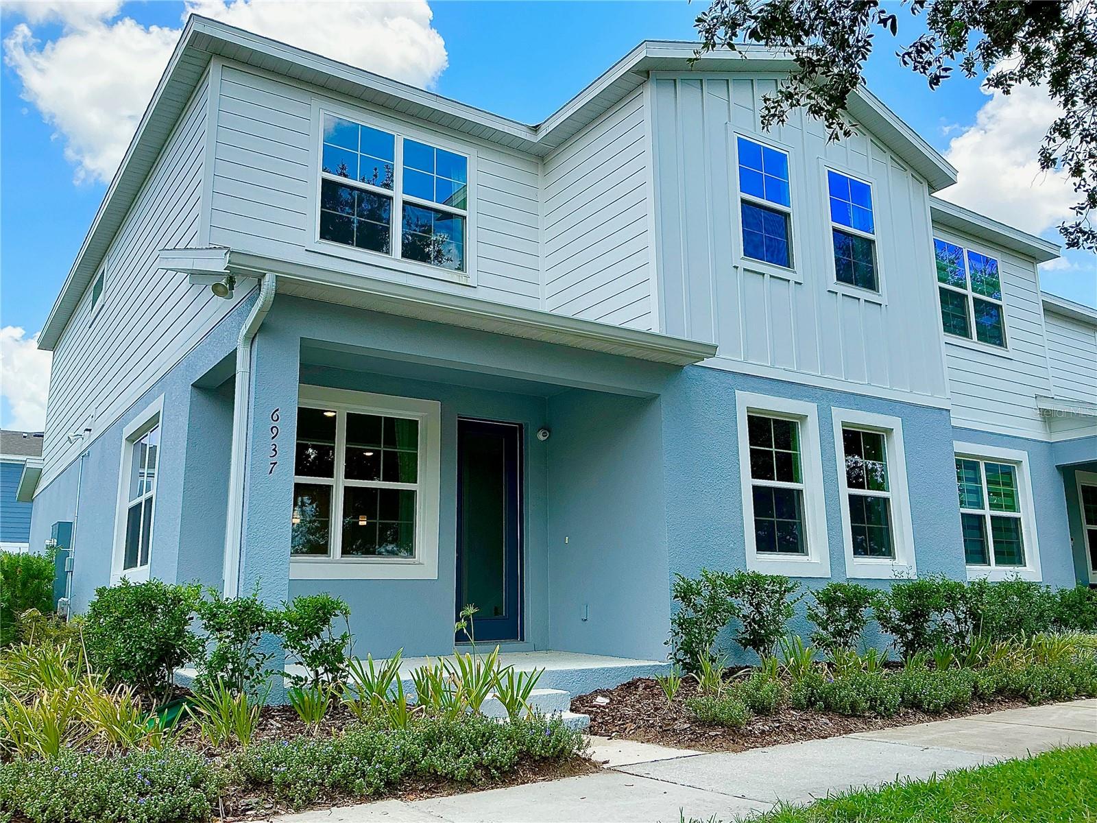 Welcome to this stunning 4-bedroom, 2.5-bathroom townhome located in the highly desirable Harmony Isle neighborhood, part of the master-planned community of Harmony. This former model home boasts 1,960 square feet an oversized two car garage beautifully designed living space and showcases top-of-the-line builder upgrades throughout. From the moment you enter, you’ll be impressed by the open-concept layout on the first floor, featuring elegant vinyl plank flooring that flows seamlessly through the spacious living room, dining area, and gourmet kitchen. The kitchen is a true centerpiece, with sleek quartz countertops, soft-close cabinetry, and high-end stainless steel appliances. Custom lighting and LED ceiling lights add warmth and sophistication to every room. A stylish metal baluster staircase leads to the second floor, where you’ll find a luxurious primary suite complete with a large walk-in closet and a beautifully appointed ensuite bathroom. Three additional bedrooms provide plenty of space for family, guests, or a home office, along with a generously sized second full bathroom.This home also features a well-designed laundry room with upper cabinets and a convenient utility sink—an often-overlooked luxury that adds to everyday comfort and function. Step outside to enjoy professionally upgraded landscaping, enhancing both curb appeal and outdoor enjoyment. Included in the sale are all window treatments, curtains, curtain rods, custom lighting, and security camera system, making this home truly move-in ready. Located within Harmony, a vibrant master-planned community, residents have access to exceptional amenities including a resort-style pool, fitness center, walking and biking trails, dog parks, playgrounds, and more. It’s the perfect blend of peaceful suburban living and modern convenience. Don’t miss the opportunity to own this one-of-a-kind, turn-key home in one of Central Florida’s most desirable communities. Schedule your private tour today!