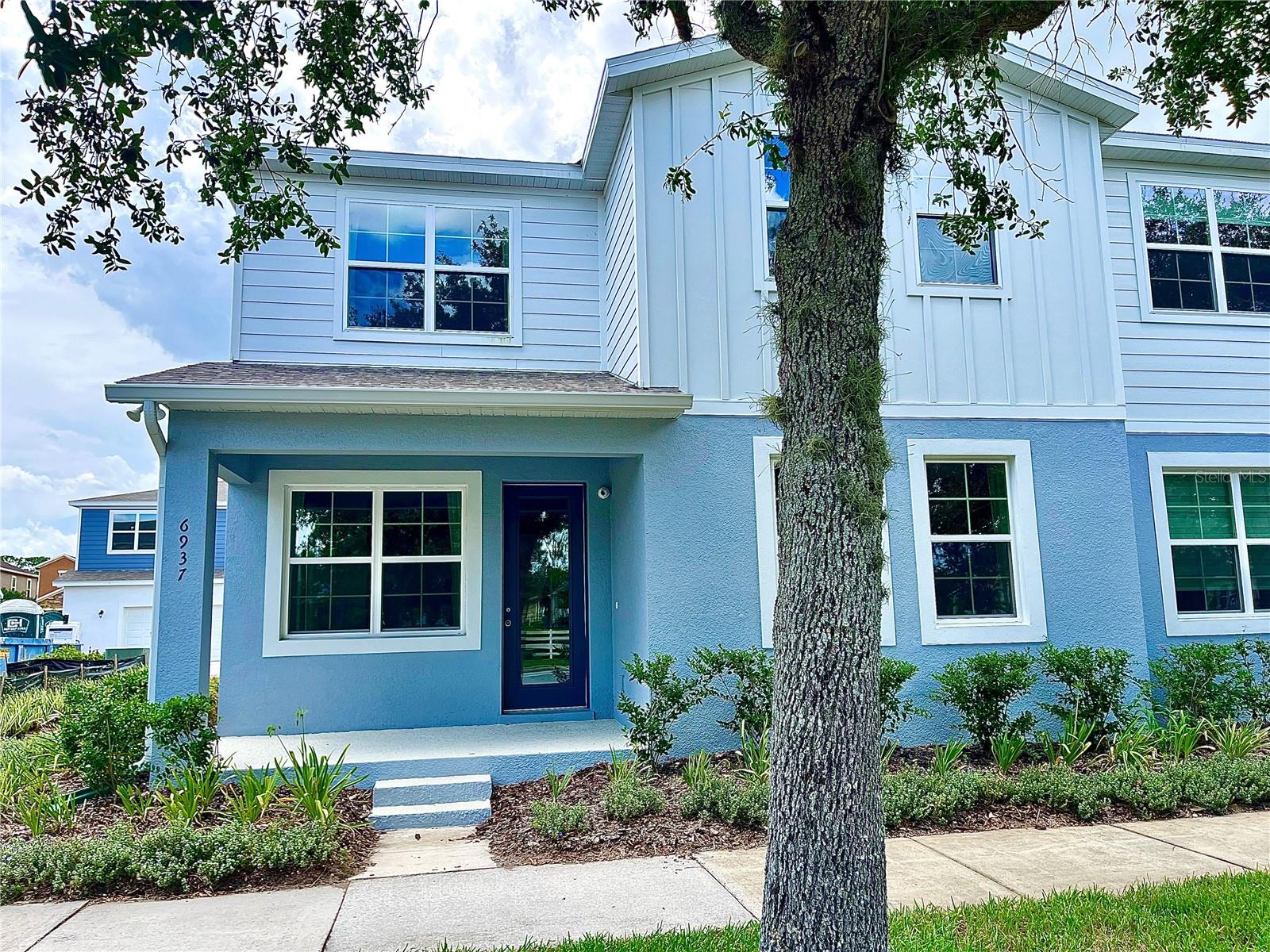 Welcome to this stunning 4-bedroom, 2.5-bathroom townhome located in the highly desirable Harmony Isle neighborhood, part of the master-planned community of Harmony. This former model home boasts 1,960 square feet an oversized two car garage beautifully designed living space and showcases top-of-the-line builder upgrades throughout. From the moment you enter, you’ll be impressed by the open-concept layout on the first floor, featuring elegant vinyl plank flooring that flows seamlessly through the spacious living room, dining area, and gourmet kitchen. The kitchen is a true centerpiece, with sleek quartz countertops, soft-close cabinetry, and high-end stainless steel appliances. Custom lighting and LED ceiling lights add warmth and sophistication to every room. A stylish metal baluster staircase leads to the second floor, where you’ll find a luxurious primary suite complete with a large walk-in closet and a beautifully appointed ensuite bathroom. Three additional bedrooms provide plenty of space for family, guests, or a home office, along with a generously sized second full bathroom.This home also features a well-designed laundry room with upper cabinets and a convenient utility sink—an often-overlooked luxury that adds to everyday comfort and function. Step outside to enjoy professionally upgraded landscaping, enhancing both curb appeal and outdoor enjoyment. Included in the sale are all window treatments, curtains, curtain rods, custom lighting, and security camera system, making this home truly move-in ready. Located within Harmony, a vibrant master-planned community, residents have access to exceptional amenities including a resort-style pool, fitness center, walking and biking trails, dog parks, playgrounds, and more. It’s the perfect blend of peaceful suburban living and modern convenience. Don’t miss the opportunity to own this one-of-a-kind, turn-key home in one of Central Florida’s most desirable communities. Schedule your private tour today!