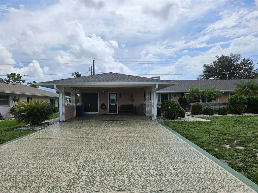 Photo of 1505 N Pebble Beach Boulevard, Sun City Center, FL 33573 (MLS # TB8535039)