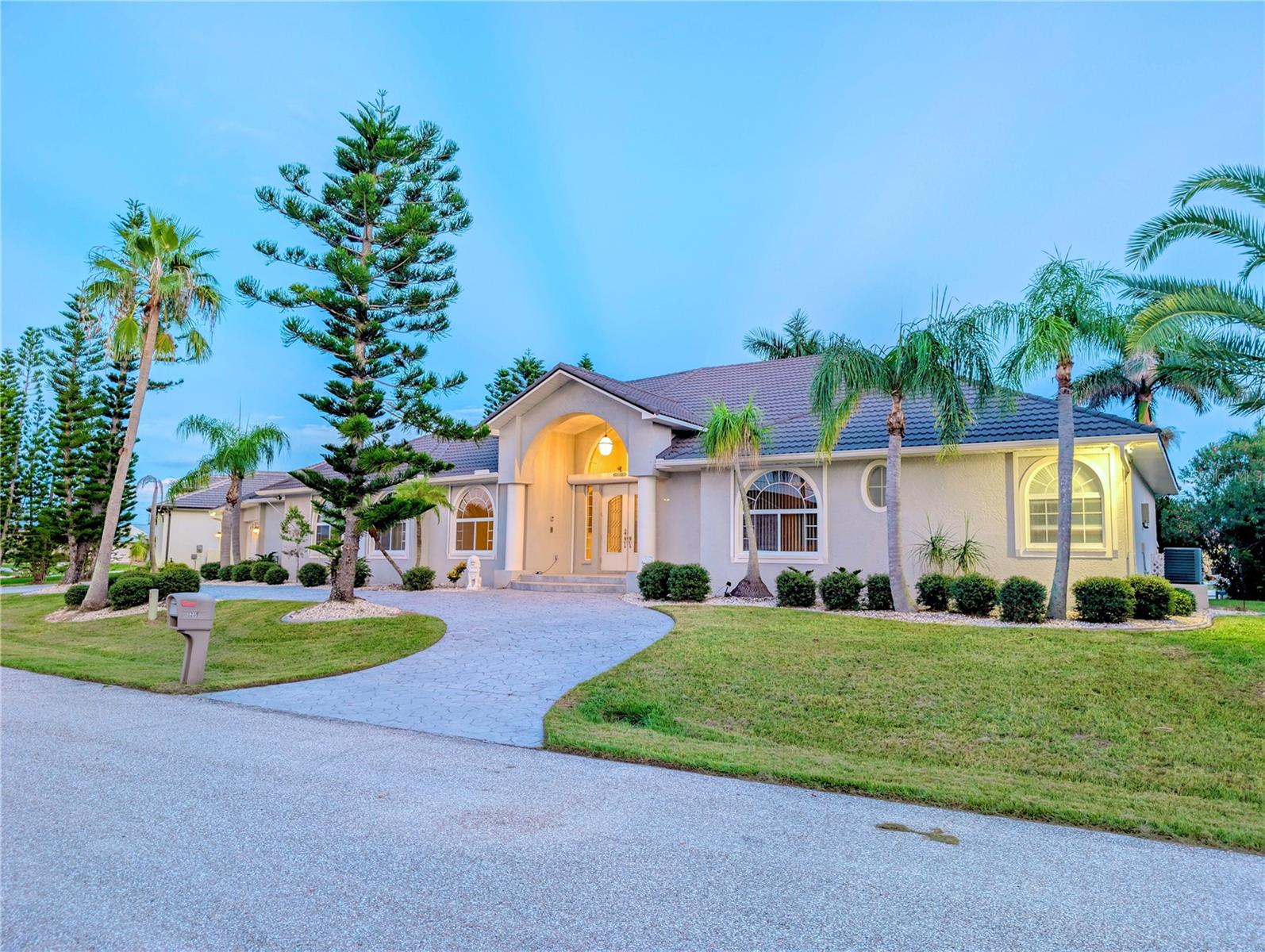 One or more photo(s) has been virtually staged. WATERFRONT EXECUTIVE RESIDENCE – Custom Built by Prestige Homes
Freshly painted and move-in ready, this extraordinary Punta Gorda Isles residence sits on a RARE DOUBLE LOT at the end of a quiet cul-de-sac. NEW SOD (2025)
A BRAND NEW ROOF (2024) with 40-year warranty, 3 new A/C units, refinished travertine floors, and a
FULLY REMODELED KITCHEN (2024) with granite countertops elevate this home to true luxury living.
Boater’s Paradise: 128-ft city-maintained concrete seawall, concrete dock with electric & water, 10,000 lb lift, and sailboat access with no fixed bridges to Charlotte Harbor & the Gulf.
Expansive Living Space: Nearly 4,400 sq.ft. under air (over 6,400 total) featuring 4+ bedrooms, 4 baths, a heated & cooled 4-car garage, great room, formal living & dining, OFFICE ROOM with Murphy bed and plus versatile bonus rooms (IN LAW) with 2 Murphy beds.
Elegant Interior: Cathedral and tray ceilings, wood-look tile, and natural light throughout. The owner’s suite offers a spa-like bath with walk-in tub, shower, and dual sinks. A guest bath doubles as a pool bath.
Outdoor Oasis: New screens, saltwater pool with new feeder, summer kitchen, covered lanai, expansive sun deck, and outdoor shower—all designed for entertaining and enjoying breathtaking canal views.
Additional Highlights: Circular driveway, storm shutters, city water & sewer, no HOA.
Prime Location: Minutes to Fishermen’s Village, historic downtown, golf, parks, walking trails, dining, and the new Sunseeker Resort.
This home combines unmatched upgrades, prime waterfront, and the ultimate Southwest Florida lifestyle.