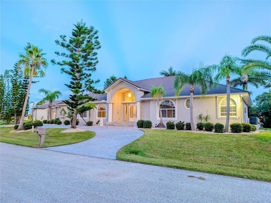 One or more photo(s) has been virtually staged. WATERFRONT EXECUTIVE RESIDENCE – Custom Built by Prestige Homes
Freshly painted and move-in ready, this extraordinary Punta Gorda Isles residence sits on a RARE DOUBLE LOT at the end of a quiet cul-de-sac. NEW SOD (2025)
A BRAND NEW ROOF (2024) with 40-year warranty, 3 new A/C units, refinished travertine floors, and a
FULLY REMODELED KITCHEN  (2024) with granite countertops elevate this home to true luxury living.

Boater’s Paradise: 128-ft city-maintained concrete seawall, concrete dock with electric & water, 10,000 lb lift, and sailboat access with no fixed bridges to Charlotte Harbor & the Gulf.

Expansive Living Space: Nearly 4,400 sq.ft. under air (over 6,400 total) featuring 4+ bedrooms, 4 baths, a heated & cooled 4-car garage, great room, formal living & dining, OFFICE ROOM with Murphy bed and plus versatile bonus rooms (IN LAW) with 2 Murphy beds.

Elegant Interior: Cathedral and tray ceilings, wood-look tile, and natural light throughout. The owner’s suite offers a spa-like bath with walk-in tub, shower, and dual sinks. A guest bath doubles as a pool bath.

Outdoor Oasis: New screens, saltwater pool with new feeder, summer kitchen, covered lanai, expansive sun deck, and outdoor shower—all designed for entertaining and enjoying breathtaking canal views.

Additional Highlights: Circular driveway, storm shutters, city water & sewer, no HOA.

Prime Location: Minutes to Fishermen’s Village, historic downtown, golf, parks, walking trails, dining, and the new Sunseeker Resort. 
This home combines unmatched upgrades, prime waterfront, and the ultimate Southwest Florida lifestyle.