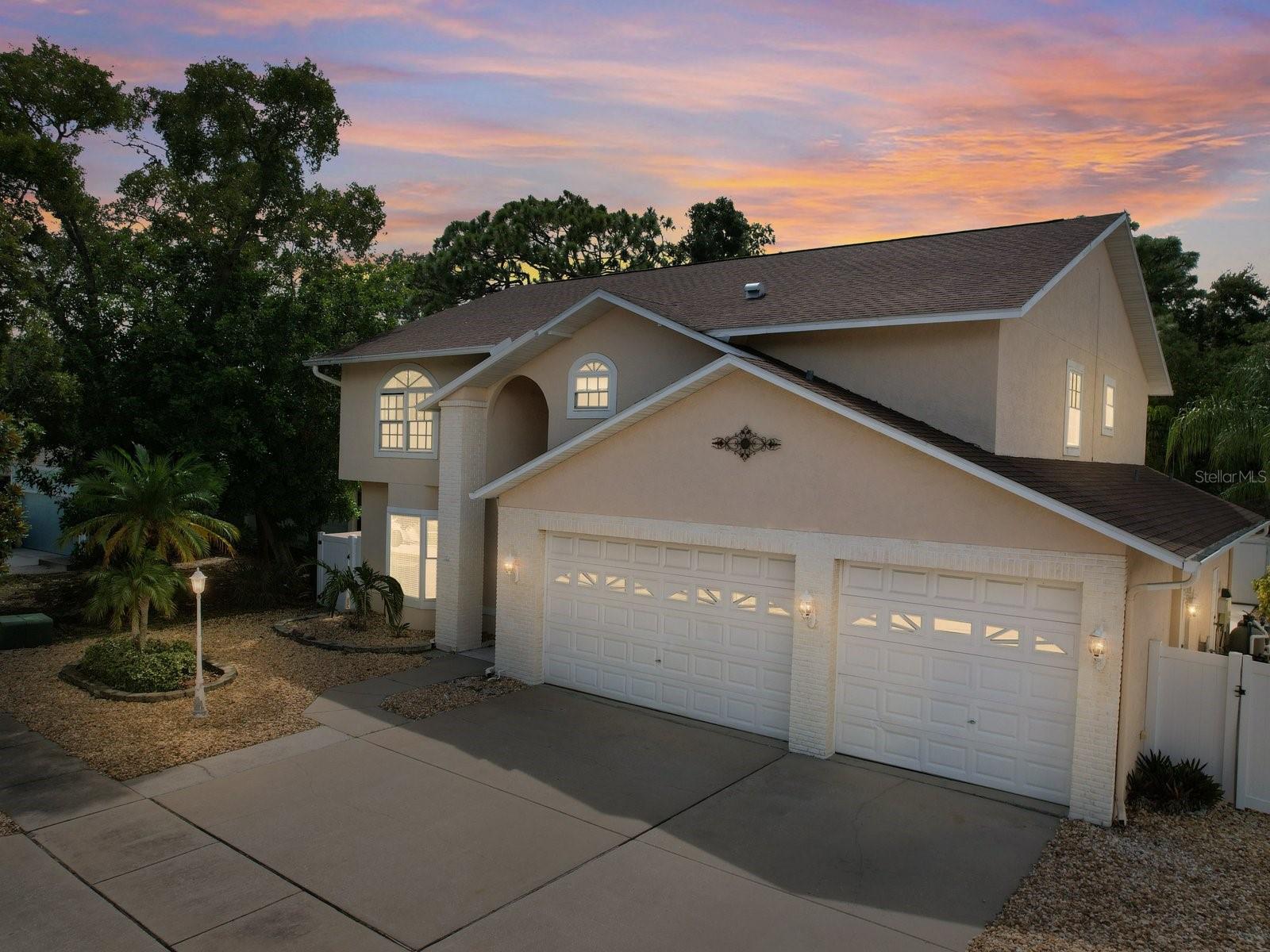 This Stunning 5-Bedroom Custom Home with Pool is Ideal for Families or Investment Opportunity offers an unbeatable combination of space, luxury, and functionality. Plus the 9 ft. + high garage opening allows for storage of any large boat or RV. Nestled in a prime location, this home is perfect for families seeking comfort or investors looking for a lucrative Airbnb opportunity. Every detail of this home has been designed with care, offering an array of amenities that make it stand out from the rest. All five bedrooms are conveniently located on the second floor, providing ample privacy. Two of the bedrooms are master sized with double closets, offering a sense of grandeur and comfort. The primary suite features a fully updated ensuite bathroom, complete with a Jacuzzi tub, a large walk-in shower, and a gorgeous double wood vanity with granite countertops—perfect for a relaxing retreat after a long day. On the main floor, you’ll find a beautifully designed office space or potential formal dining room, featuring crown molding and a large bay window that bathes the room in natural light. The heart of the home is the gourmet kitchen, outfitted with stainless steel appliances, a gas stove, a large center island, and a breakfast bar, making it perfect for both cooking and entertaining. The adjacent family room leads you to an inviting backyard through sliding doors, where a heated, pebble-tech saltwater pool awaits. The vinyl-fenced backyard is private and low-maintenance, featuring decorative rocks that add elegance without extra upkeep. The home also boasts a spacious laundry room that turns chores into a breeze and a 3-car garage with large bay doors, ideal for storage or parking. Recent updates include a dual-system A/C installed in 2020 and additional one in 2008 a with a roof replacement in 2014, ensuring comfort and efficiency year-round. With its stunning design and prime location, the current owners have successfully operated the property as a highly sought-after Airbnb when not in residence, opening up exciting opportunities for extra income. Whether you're looking for your dream family home or an investment property with endless potential, this spacious, luxurious, and well-maintained home offers everything you could need.