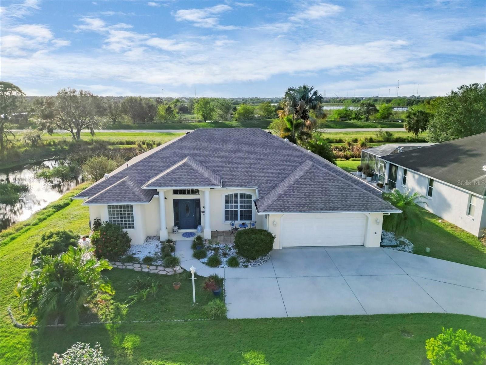 Rarely available pool home in Meadow Walk. Welcome to this meticulously maintained three-bedroom, two-bath residence offering 1,941 square feet of living space on nearly a quarter-acre lot. This home has never experienced flooding or hurricane damage, according to the owner, and features a new roof (2023), new HVAC compressor, and new water heater, ensuring long-term peace of mind and energy efficiency. Go outside to your private oasis, complete with a resurfaced pool and upgraded decking, plus an expanded outdoor entertainment area ideal for relaxing or hosting guests. Multiple seating areas throughout the property invite you to enjoy the serene natural surroundings. For added security, Ring and Blink cameras are strategically installed around the exterior. Inside, the primary suite exudes comfort and elegance with tray ceilings, dual walk-in closets, a deep soaking tub, private water closet and dual vanities in the en-suite bath. The home also includes a whole-house water softener and a reverse osmosis system in the kitchen. Enjoy casual meals in the eat-in kitchen or entertain in the formal dining room. Additional upgrades include hurricane shutters, a new hurricane-rated entry door, and partial hurricane window replacements with a fully transferable warranty. An additional patio offers panoramic views of the scenic Celery Fields, providing a front-row seat to Florida’s diverse bird and aquatic life. Ideally near premier shopping at UTC Mall and dining at Waterside, this home also resides in an A-rated school district, offering access to Tatum Ridge Elementary, McIntosh Middle and Sarasota High School.