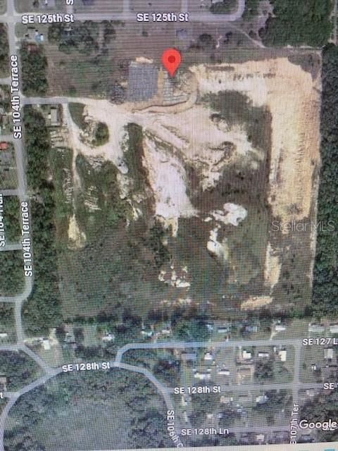 Photo of 12557 SE 104th Terrace, Belleview, FL 34420 (MLS # OM696754)