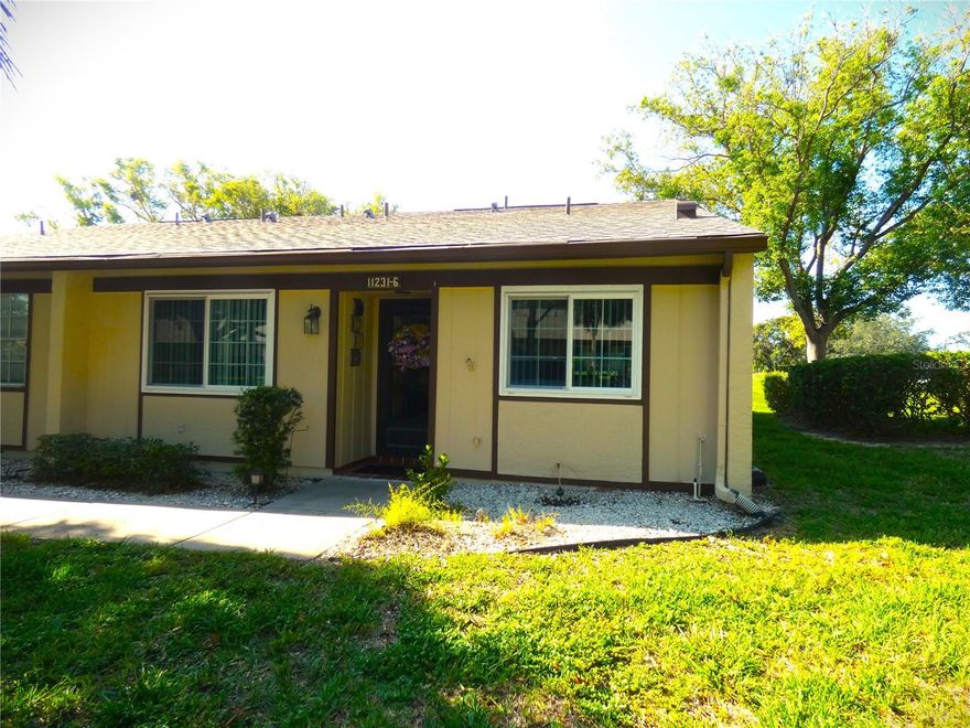 Own a piece of Paradise! Welcome to this inviting split plan 2-bedroom, 2-bath condo in Dollar Lake Village within the highly sought-after Timber Oaks 55+ community. The HOA fee covers, internet, garbage pick up, water, sewer insurance on the building, pool maintenance, lawn care and so much more. This freshly painted interior end unit with open floor plan, large kitchen with newer kitchen cabinets will make you enjoy entertaining and cooking for friends and family. The spacious living room is inviting and has a great view of the back yard with no immediate rear neighbors.  Relax and enjoy your morning coffee in this large enclosed Lanai. The condo has its own private carport parking space and a storage unit with plenty of guest parking and is walking distance to the pool. This unit is in a great location and close to shopping, restaurants, beaches, parks and the library. Easy commute to Clearwater and the Tampa Airport via the Suncoast parkway. New roof in 2024.