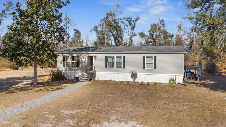 One or more photo(s) has been virtually staged. Country living at its finest.  This very well-kept manufactured home sits on 5 acres.  Seller would like to sell with adjacent 5-acre lot with mobile home.