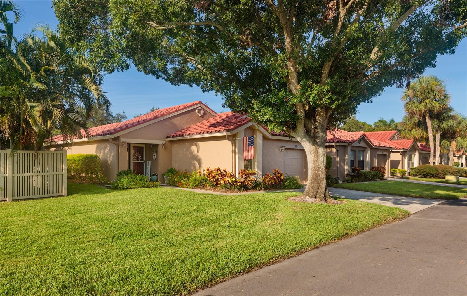 PERFECT in Placido Bayou ~ Location, Location, Location! Fall in LOVE with this BEAUTIFUL RARE one-story 2 bedroom and 2 bathroom Villa in the BEAUTIFUL GUARD GATED community of PLACIDO BAYOU ~ one of the BEST locations in Pinellas County! YOU WILL LOVE the maintenance free living in this community situated in this Northeast Placido Bayou Neighborhood! Pull up to LUSCIOUS oak and palm trees, bright blooming flowers, pavers, and wonderful curb appeal. This BEAUTIFUL, SPACIOUS 1,250 sq ft home has 2 bedrooms, 2 bathrooms, and a 1 CAR GARAGE. This remarkable residence showcases amazing features and finishes that epitomize sophistication and elegance with a FARMHOUSE FLAIR. The seamless open concept layout harmoniously integrates all of the living spaces. This CHARMING HOME provides a well-thought-out floor plan. As you enter the front doors, YOU WILL LOVE the abundance of natural light, tile flooring, and several doors that open up to the BEAUTIFUL OUTDOOR PAVED lanai. This perfect family home has everything you could want from Tile Roof, Open Floor Plan, NEW Interior Paint, Newer Exterior Paint, NEW Double Oven, NEW Dishwasher, Barn Door, Shiplap Accent Wall, Paver Patio and much more! This adorable family home has a split floorpan offering a large primary suite, SPACIOUS walk-in closet, an en-suite bathroom with walk-in shower and NEW glass doors on one side and a spacious 2nd bedroom with shiplap accent wall and luxury vinyl flooring on the other side. This home is open and inviting ~ allowing the chef to be part of the activity. YOU WILL LOVE COOKING in the BEAUTIFUL OPEN CUSTOM kitchen, which is a chef's dream! It is very spacious with a BRAND NEW DOUBLE OVEN, NEW Dishwasher, beautiful cabinetry, butcher block countertops, stainless appliances, and LARGE breakfast bar. The kitchen opens up to a bright cozy family room and dining room. The private backyard lanai is perfect for entertaining. LOVE the spacious 1 car garage and ample driveway parking. Every aspect of this home has been meticulously designed and maintained and is being sold turnkey! This home has NEVER FLOODED and is MOVE-IN READY! The LOW HOA includes ~ CABLE TV and INTERNET, exterior paint on building, lawn maintenance, 24 hr GUARD GATED security and community pool! Don't miss the chance to experience the Placido Bayou Gated Community lifestyle which offers a serene peaceful lifestyle with AMAZING wildlife such as ~ ducks, otters, turtles, fish, bunnies, and more. Enjoy this maintenance free lifestyle of living! Placido Bayou is one of the BEST locations offering quick access to DOWNTOWN ST. PETE, airports, beaches, interstates, shopping, and restaurants. YOU MUST SEE this little bit of Florida Paradise in this Guard Gated MAINTENANCE FREE COMMUNITY!