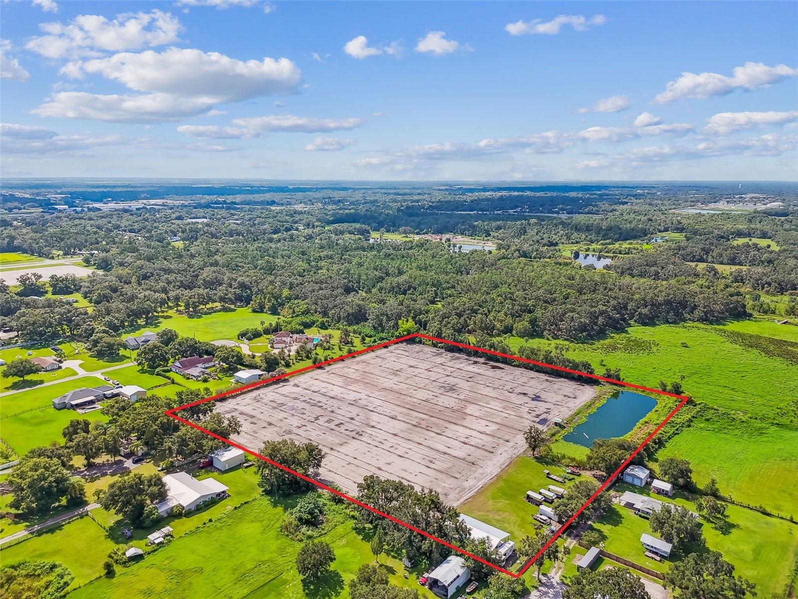 Welcome to 1715 W Sam Allen Rd in Plant City, a rare opportunity to own a 10-acre operating strawberry farm in one of Florida’s most desirable farming communities. This property is an excellent investment for farmers, agribusiness operators, or anyone looking to expand into agricultural ventures. With fertile soil, a reliable irrigation system, and established farm operations, it is well-suited for continuing strawberry production or exploring other crops.
The property features a 40x60 open shed with a concrete floor, water and electricity connections, and a 33-foot RV that is included in the sale. Irrigation is supported by a pump system that draws from the retention pond, and the main portion of the land is serviced by a 4-inch well. A sturdy wood fence surrounds the property, adding both function and security.
Zoned ASC-1, this farm not only supports active agricultural use but also provides the potential to build your dream home on-site. Don’t miss the chance to own this incredible piece of farmland in the heart of Florida’s strawberry country.