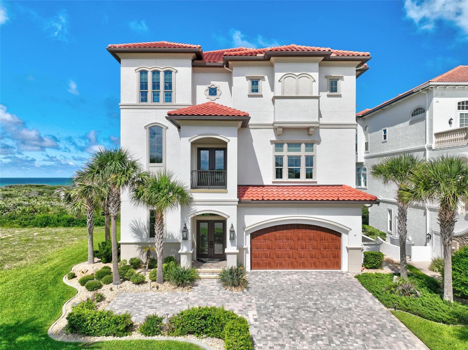 Introducing a stunning oceanfront home nestled within the exclusive Ocean Hammock gated community. This exquisite residence boasts breathtaking views of the Atlantic Ocean and pristine beaches, offering a perfect blend of luxury and tranquility.
Over 5000 square feet of meticulously designed living space, the home features unparalleled craftsmanship and elegant architectural details. The third-floor main living area is designed to maximize panoramic ocean views, providing a serene and picturesque setting for relaxation and entertainment.
The home includes an elevator for easy access to all levels, a private beach walkover for direct beach access, and a private pool complete with a poolside kitchen, living room, and pass-through window for added convenience. A full bathroom is accessible from the pool area, enhancing the outdoor living experience.
For ultimate comfort, the home is equipped with a state-of-the-art Control 4 audiovisual system and an advanced security system, ensuring both entertainment and peace of mind. Practical features include two laundry rooms located on the second and third levels, adding to the home's functionality.
Every detail of this magnificent oceanfront home has been crafted to create an unparalleled living experience. Whether enjoying the private pool, entertaining in the outdoor living areas, or simply relaxing to the sound of waves, this residence offers the ultimate in luxury and comfort. https://see.virtualopen.house/v/fQY4nJc