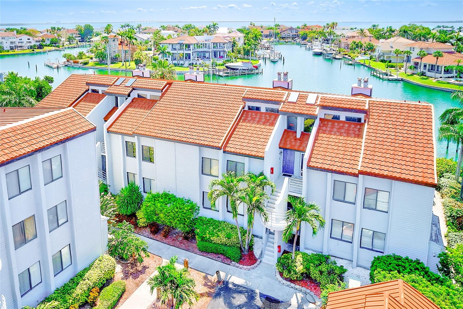 Welcome to this beautiful 2-bedroom, 2-bathroom first-floor waterfront condo in the peaceful and private community of Ciega Verde. Enjoy serene views of the intracoastal waterway right from your covered back patio, where you can unwind amid lush landscaping and relaxing breezes.
Inside, the kitchen is a true centerpiece—featuring rich wood shaker cabinets, granite countertops, a center island, decorative open shelving, stainless steel appliances, and tile flooring throughout. Expansive windows flood the space with natural light, especially in the dining area which overlooks the tranquil canal.
The spacious primary suite offers dual closets and a luxurious ensuite bathroom complete with a modern barn door, double vanity, and floor-to-ceiling tiled standing shower. The secondary bedroom is generous in size, with garden views and abundant natural light. An updated guest bathroom in the hallway features a quartz countertop vanity, a tub/shower combo with pebble flooring, and a lighted mirror.
The open-concept living area connects seamlessly to the kitchen and includes a wood burning fireplace and large sliding glass doors leading to the covered patio. The patio itself boasts beautiful floral-patterned deco flooring, a bar area, kitchen pass-through, new ceiling fan, and convenient storage—perfect for entertaining or relaxing outdoors.
Additional highlights include a dedicated inside utility closet with a full-size washer and dryer, making laundry easy and accessible, and an assigned covered parking space just steps from your front door.
Ciega Verde is an intimate, laid-back community with just 32 units—less than half of which are occupied year-round—offering privacy and a true sense of retreat. Community amenities include a pool, walking paths, waterfront seating, and fishing. Just minutes away is one of the world’s most unique nature preserves, a cluster of "Keys" reminiscent of the Florida Keys, offering endless opportunities to explore.
Enjoy quick and easy access to the Gulf of Mexico by boat (slips are available to rent) and be just a 10-minute drive from downtown St. Petersburg, renowned restaurants, and the world-famous beaches of St. Pete Beach and Pass-a-Grille.
Everyone who stays here falls in love—come see why. Schedule your private showing today!