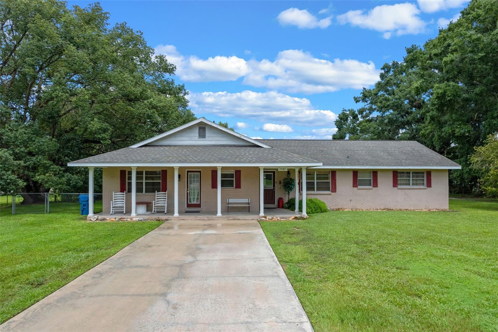 Spacious Home with Pool, Guest Suite & Rental Potential
There’s plenty of room here—inside and out! This concrete block home has a nice layout with 4 bedrooms, 3 baths, two living areas, and a big laundry room with lots of shelving.
Attached by a transition hallway, walk into the private guest suite with its own separate entrance. It has a full kitchen, living area, and a huge bonus room that works great as a 4th bedroom —perfect for guests, visitors, or even rental income.
Out back, you’ll love the screened pool and lanai, plus a very cool detached 2 ½ car garage/workshop (720 sq ft!) with enough space to park a boat, car, and golf cart—with tons of storage to spare. There’s also a fenced quarter-acre backyard for pets, gardening, or just hanging out—AND an RV/EV hook-up ready to go.
This is a golf cart-friendly community with wooded hiking trails, so it’s easy to get out and explore.
The roof was replaced in 2023, and the whole property is surrounded by gorgeous oak, magnolia, camphor trees—and even bamboo—for tons of shade, privacy, and character. No HOA—just a peaceful spot to call home.
This one’s packed with extras—you won’t want to miss it!