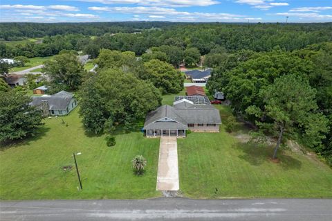 Photo of 7484 Redbud Lane, Brooksville, FL 34601 (MLS # V4943753)