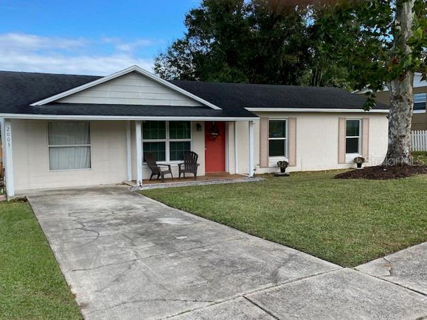 This is the perfect opportunity for the FIRST TIME BUYER. Lakeview Property, 3 bedrooms, 1 1/2 baths, bonus room, NO HOA, NO rear neighbors. Extra features: Updated kitchen cabinets 2019, decorative stone backsplash 2019, new french doors & refrigerator 2023, Luxury vinyl wood flooring 2021,new interior electrical panel 2023, new hot heater 2023, roof 2017, new low energy windows 2022. Oversized backyard with a water view of Lake Meadows, perfect for family gatherings and create amazing memories. Close to schools, churches, hospital, West Oaks Mall, grocery stores, coffee shops, restaurants, parks, golf course and Downtown Ocoee. Easy access to main highways 429, Florida Turnpike and 408. Call today to book your appointment!!! This cozy home won't last long!!!